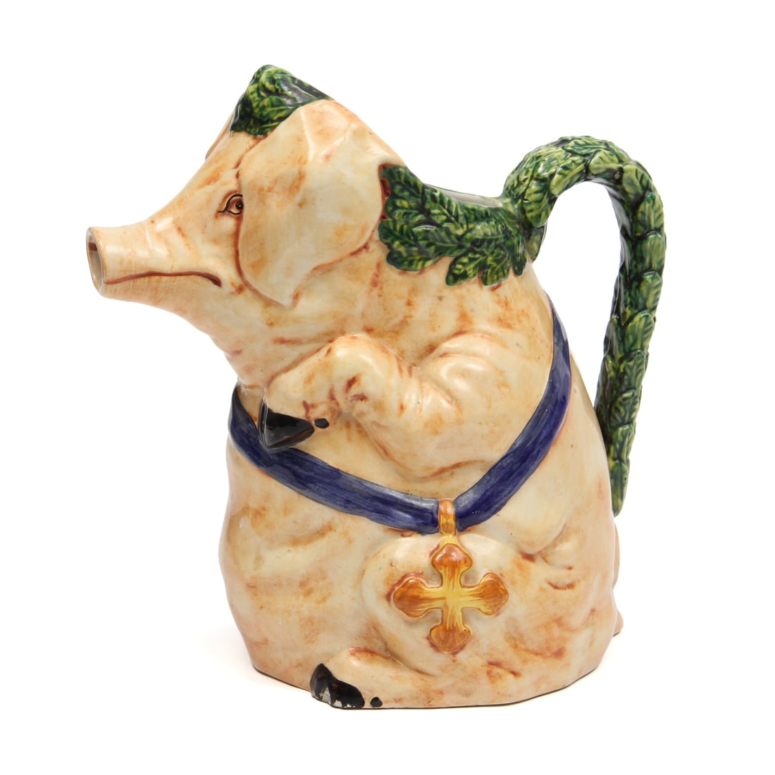Vintage Italian Pig Formed Pitcher: A vintage Italian pitcher in the form of a pig. Piece has a leaf designed handle with a pig nose spout. Marked Italy to base. w 5, h 8, d 8 inches.