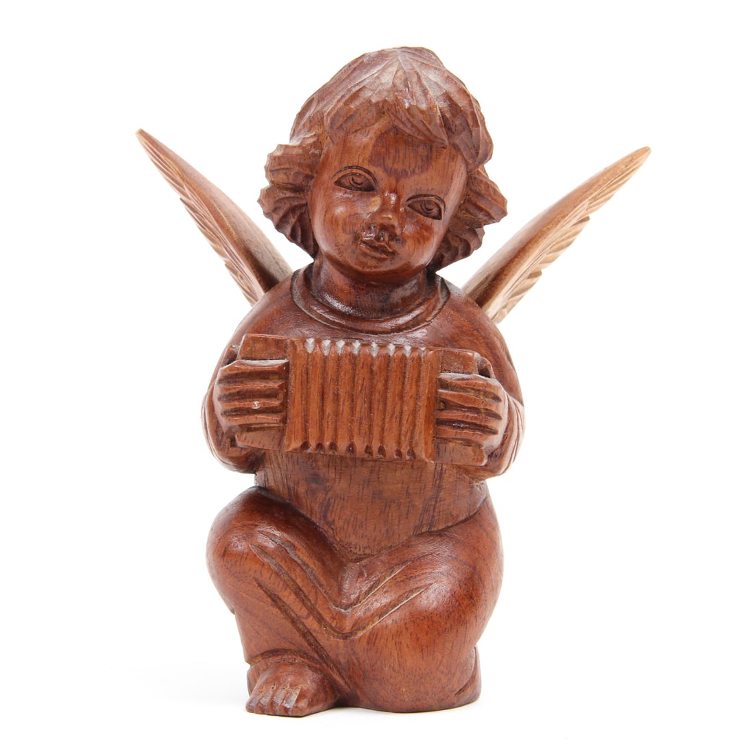 Walnut Carved Cherub Sculpture: A vintage carved walnut cherub of cherub playing the accordian. 4w, 6h, 4d inches.
