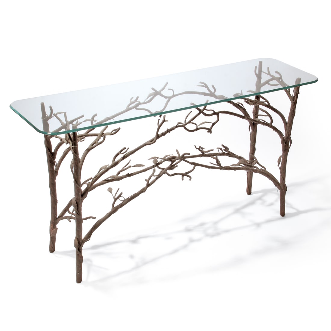 Alberto Giacometti Style Faux-Bois Console Table: A vintage console table with glass top with a faux-bois design in the style of Alberto Giacometti. The table has a natural wood/vine motif in shades of brown made out of metal. Measures 29h x 56w x 16
