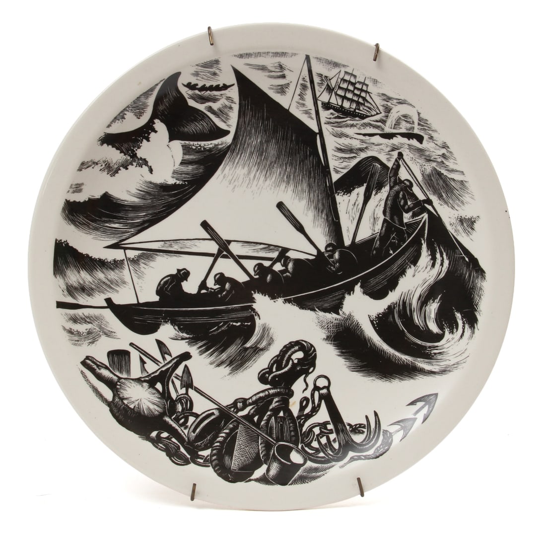 Clare Leighton Wedgewood Whaling Plate: A vintage plate depicting a black and white whaling scene to its face from a wood engravign by Clare Leightin for Wedgewood. Piece is on a metal spring wall hanger. 10.5w, 1h inches.