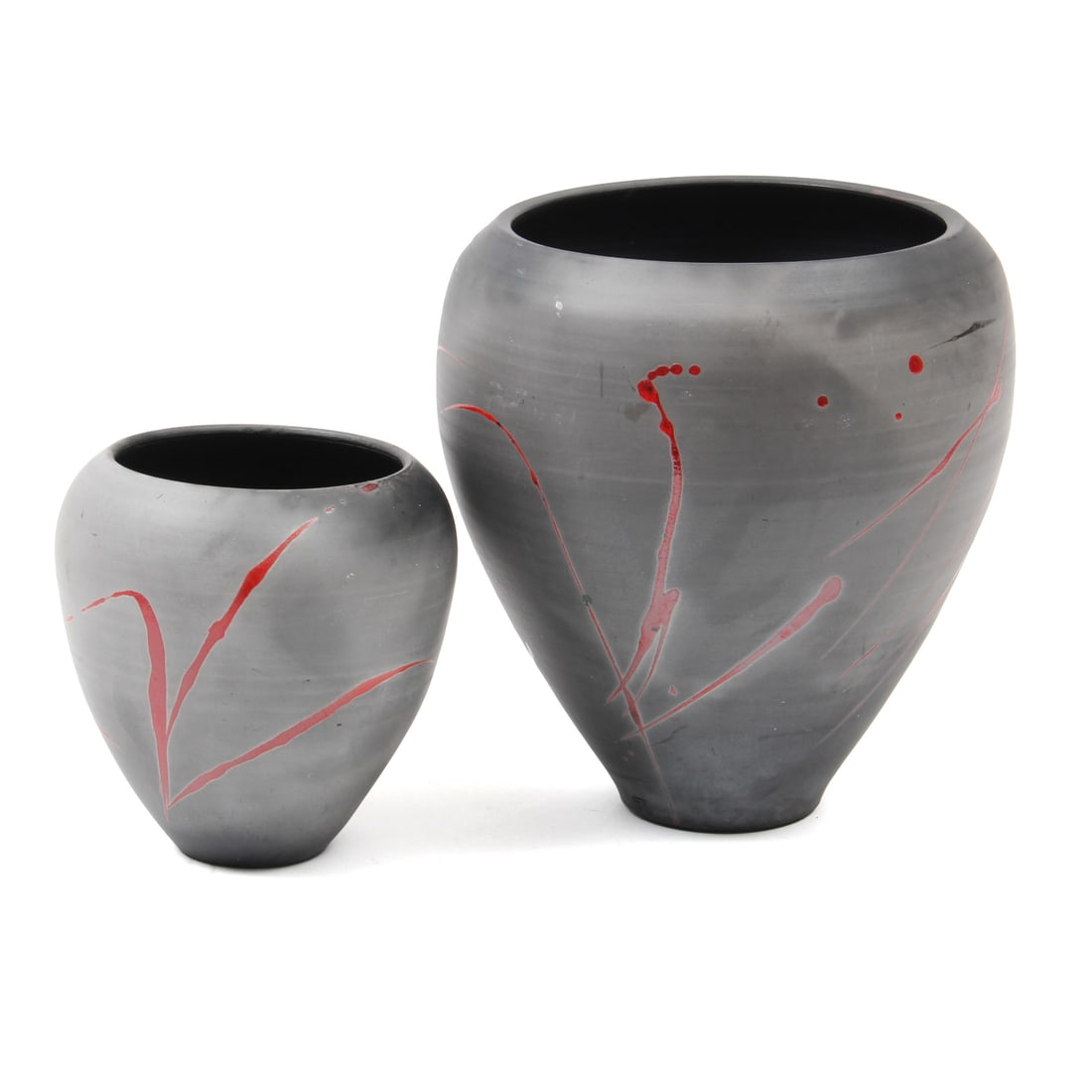 Pair of Bob Reiberg Ceramic Vases: A pair of ceramic vases by potter Bob Reiberg, these vases feature a grey form with a red splatter design. 8w, 10h inches (of largest piece)
