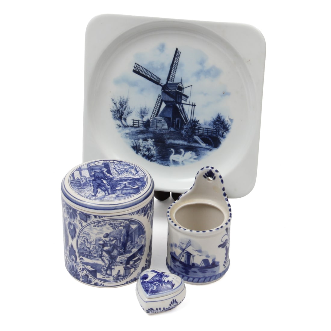 Delft Blue & White Ceramic Wares: A colelction of Delft ceramic wares including a 4.5" tall scenic tobacco jar, 2.25" heart-shaped trinket box, 4.5" tall salt cellar, and 8" scenic plate.