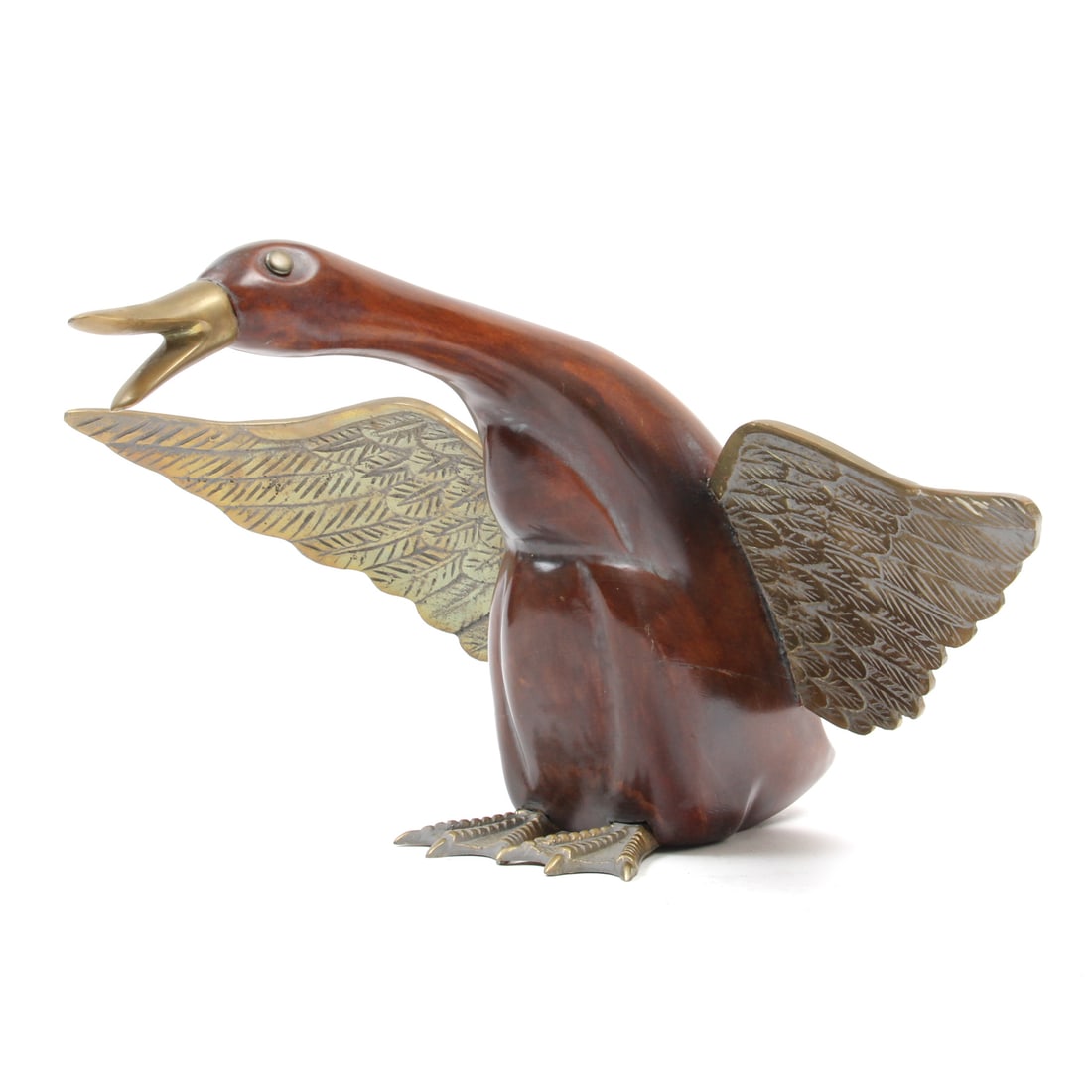 Frederick Cooper Brass & Wood Duck Sculpture: A vintage sculpture of a a duck with a wood body and brass eyes, bill, feet, and wings. Marked with sticker to bottom. 16w, 7h, 14d inches.