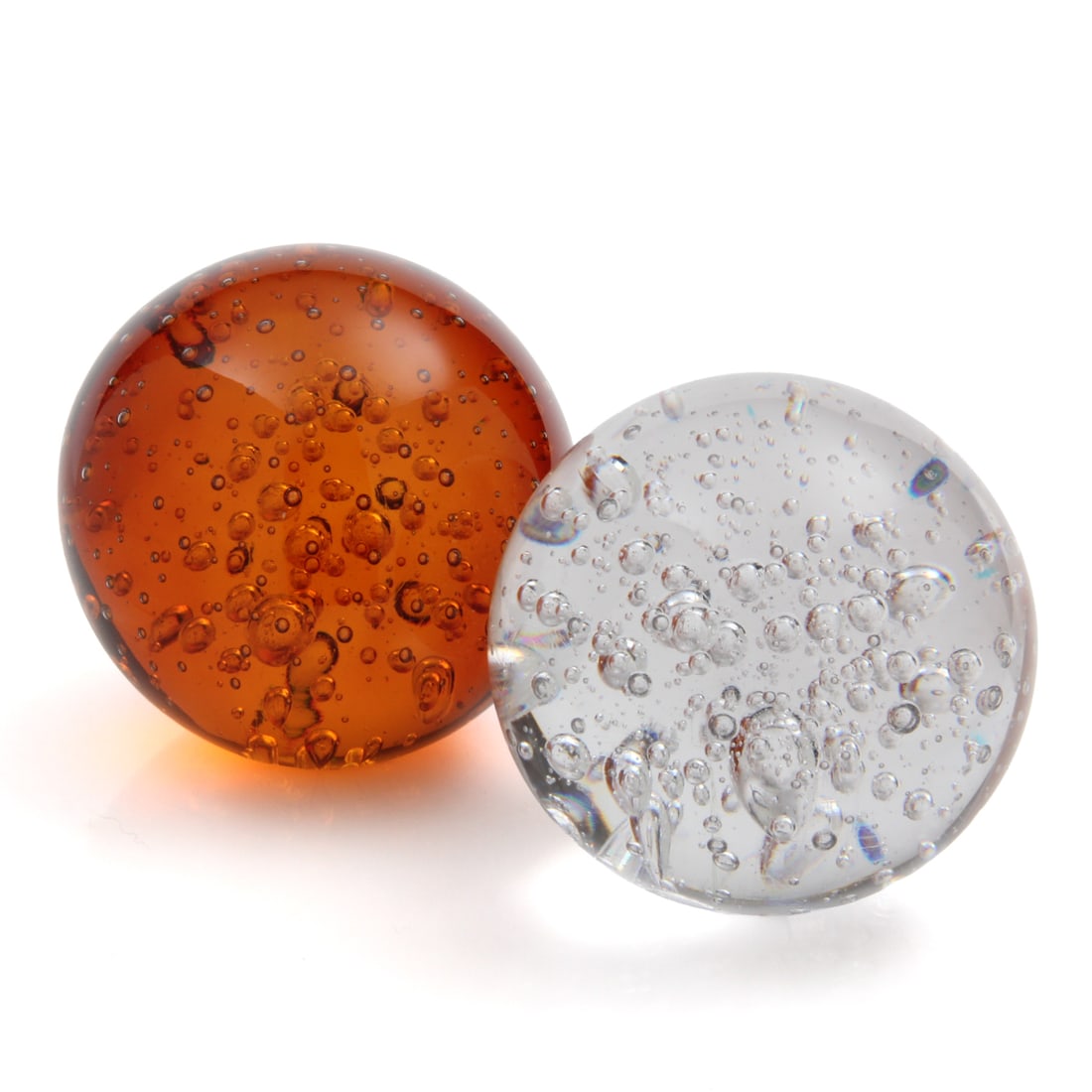 4" Bubble Glass Paperweights, Pair: A pair of hand blown glass paperweight with freeform bubble design, lot includes one clear glass, and one amber/orange paperweight. 4w, 4h (of one piece).
