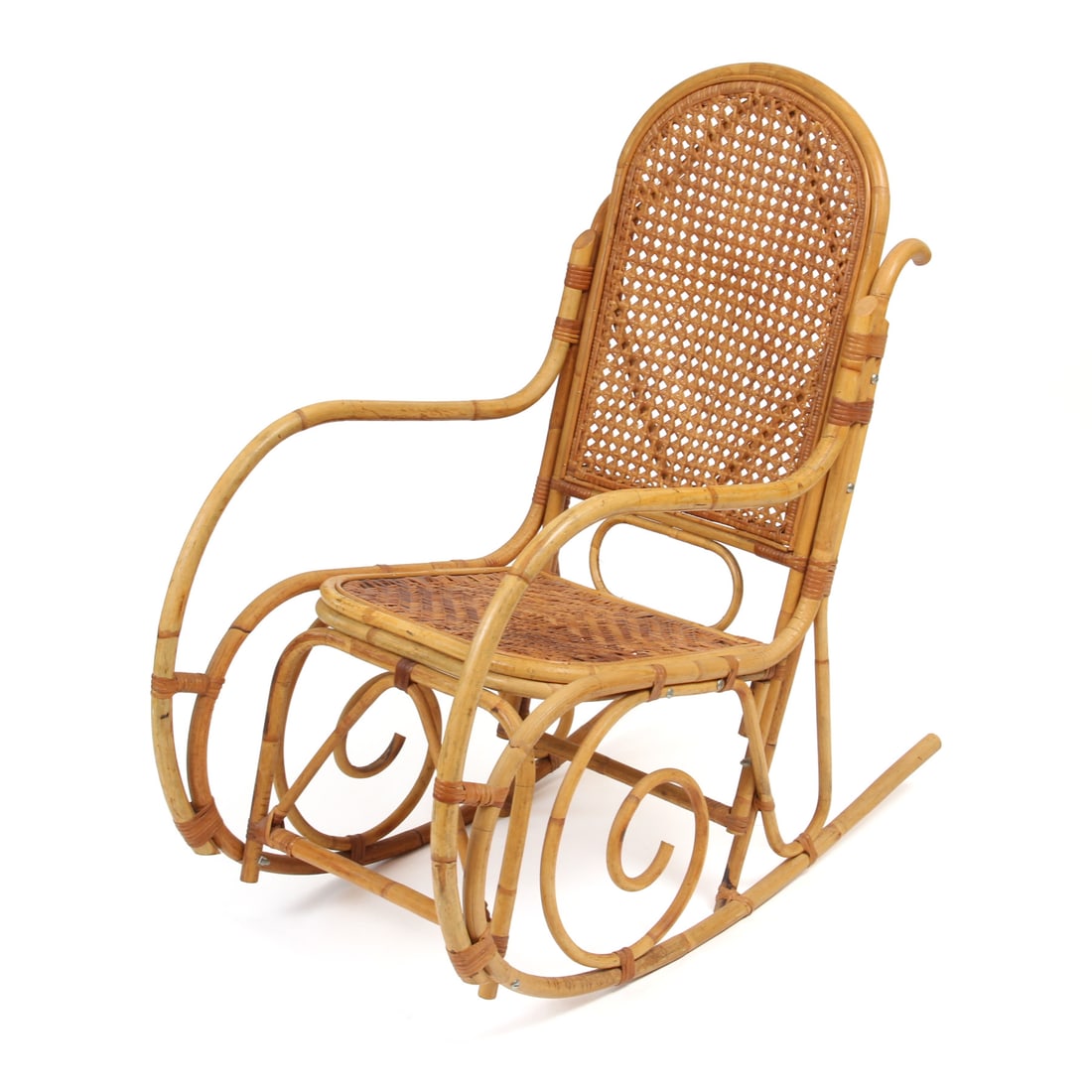 Vintage Cane Bentwood Wicker Rocking Chair: a vintage bent cane wood rocking chair with woven seat and back rest. 20w, 40h, 21w inches.
