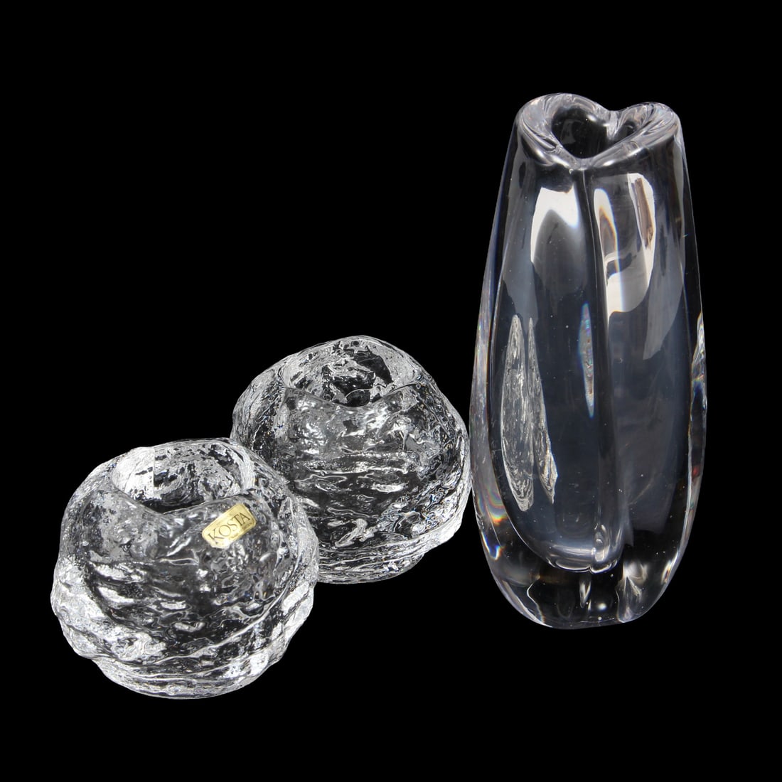 Kosta Snowball Votives and Crystal Vase: A collection of Kosta Boda to incude two "snowball" style votive holders and one crystal vase, both marked "KOSTA". 3w, 7.5h inches (of vase)
