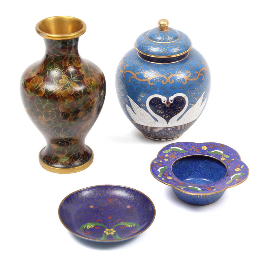 Collection of Cloisonne Pieces: A collection of cloisonne pieces to incude a swan lidded jar, floral designed vase, a small blue dish, and a blue tea light holder with bird design. 3.3w, 6h (of tallest piece).