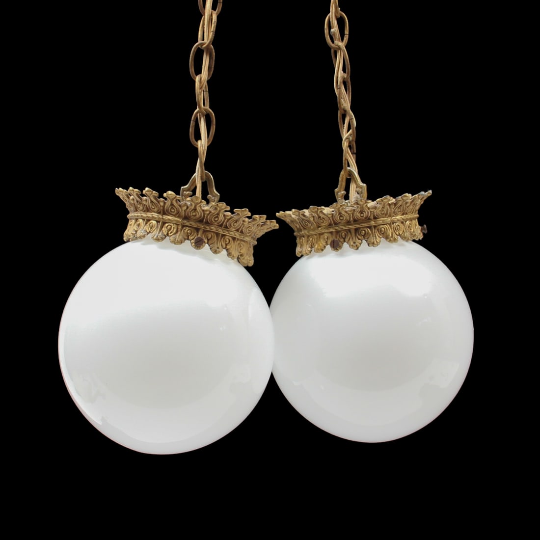 Hollywood Regency Style Hanging Globe Pendant Lamp: a Hollywood Regency style pendant lamp with two chain supported white glass globes. Globes hange to 55 inches long and the two pendants combined are 15 inches wide.
