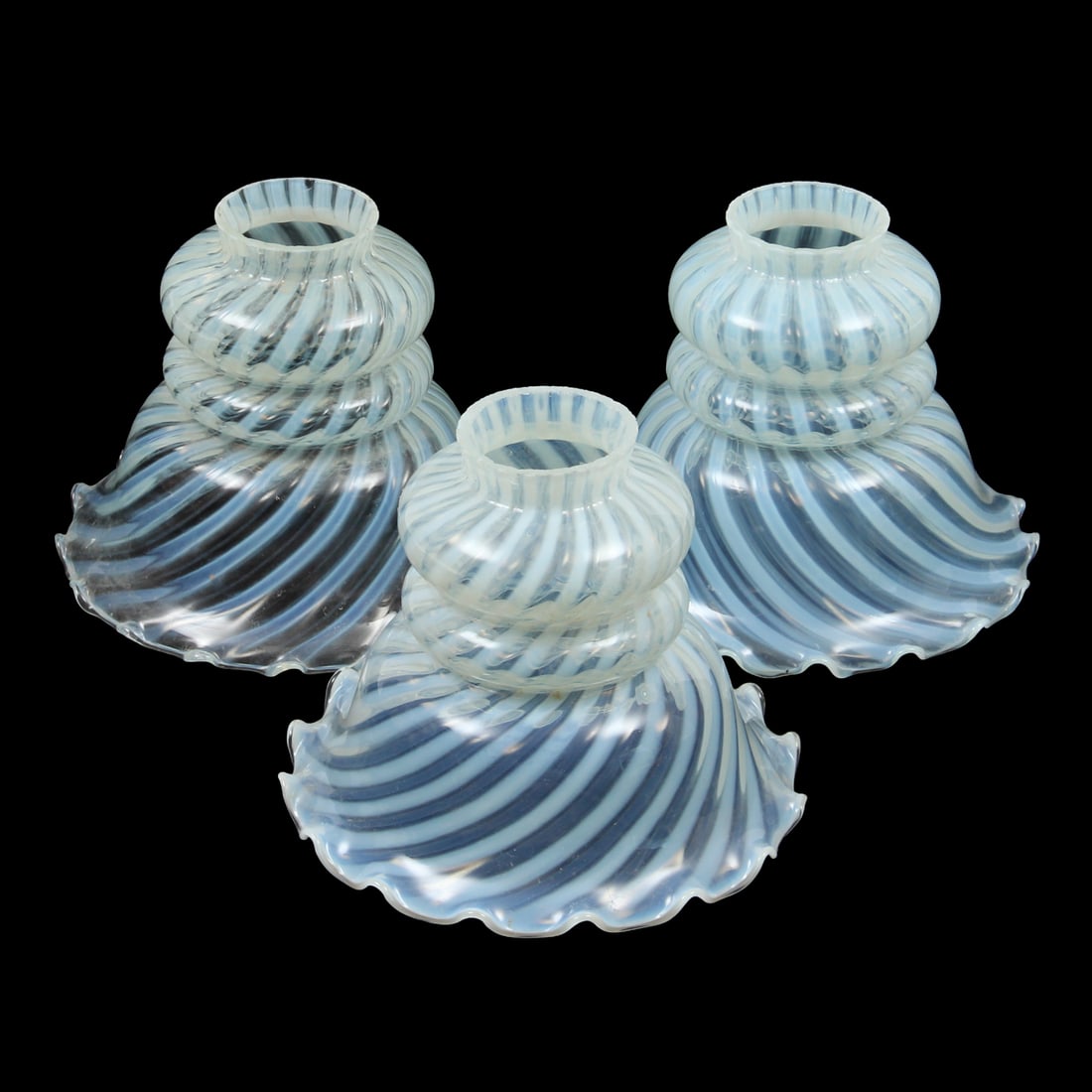 Opalescent Swirled Glass Lamp Shades With Ruffled Edges: A grouping of 3 swirled glass opalescent lamp shades with ruffled edges. 6.75w, 5.25h inches (of one piece)
