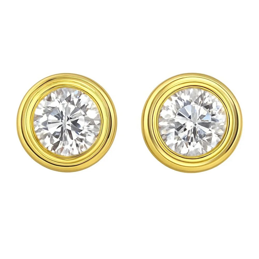 Bezel Set 18K Yellow Gold Round Brilliant Stud Earrings: Classic meets contemporary in these Bezel Set Round Brilliant Stud Earrings, beautifully crafted in 18K yellow gold. Each earring features a luminous round-cut center stone, securely nestled in a poli