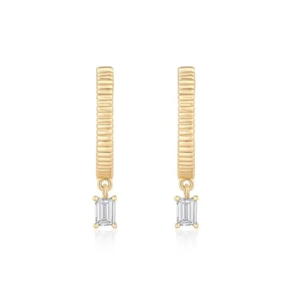 Emerald Cut Drop Charm 14K (or 18k upon request) Yellow Gold Huggie Earrings: The Celestial Dream Huggies Earrings feature exquisite emerald diamonds set in luxurious 14K yellow gold. With 0.16ct of baguette-cut emerald diamonds, these earrings offer a unique and radiant sparkl