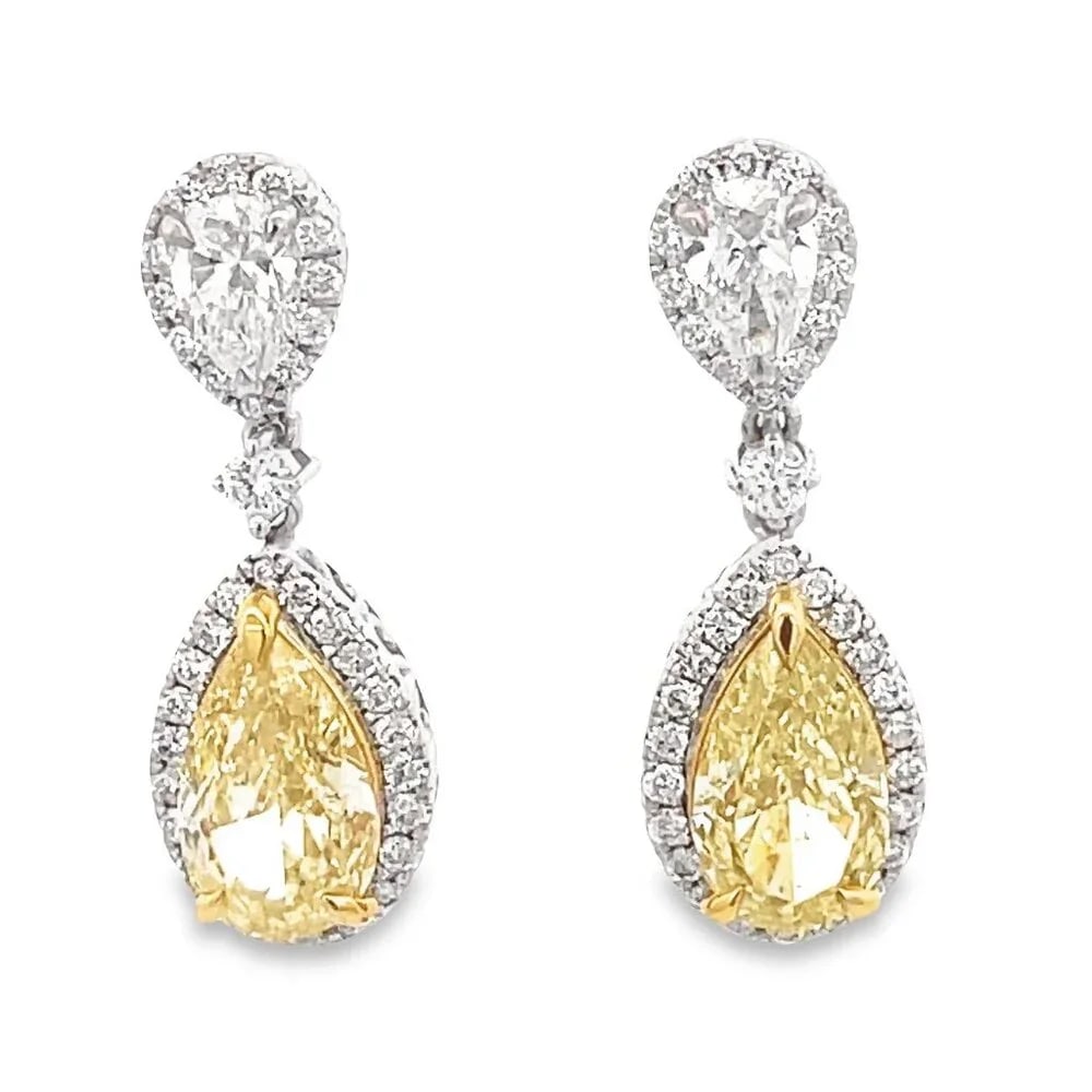 Pear Shaped 14K (or 18k upon request) Drop Diamond Waterfall Earrings: Make a statement with these glamorous pear-shaped drop earrings, adorned with radiant natural diamonds. Set in 14k white gold, their elegant design offers a dazzling touch perfect for elevating any lo
