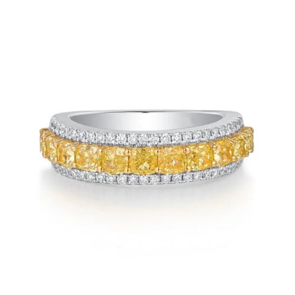 Two Tone 14K (or 18k upon request) Yellow Gold Diamond Eternity Ring: The Two Tone 14K Yellow Gold Diamond Eternity Ring is a stunning piece crafted from 18K white gold. It features a combination of natural diamonds and fancy yellow diamonds, offering a beautiful