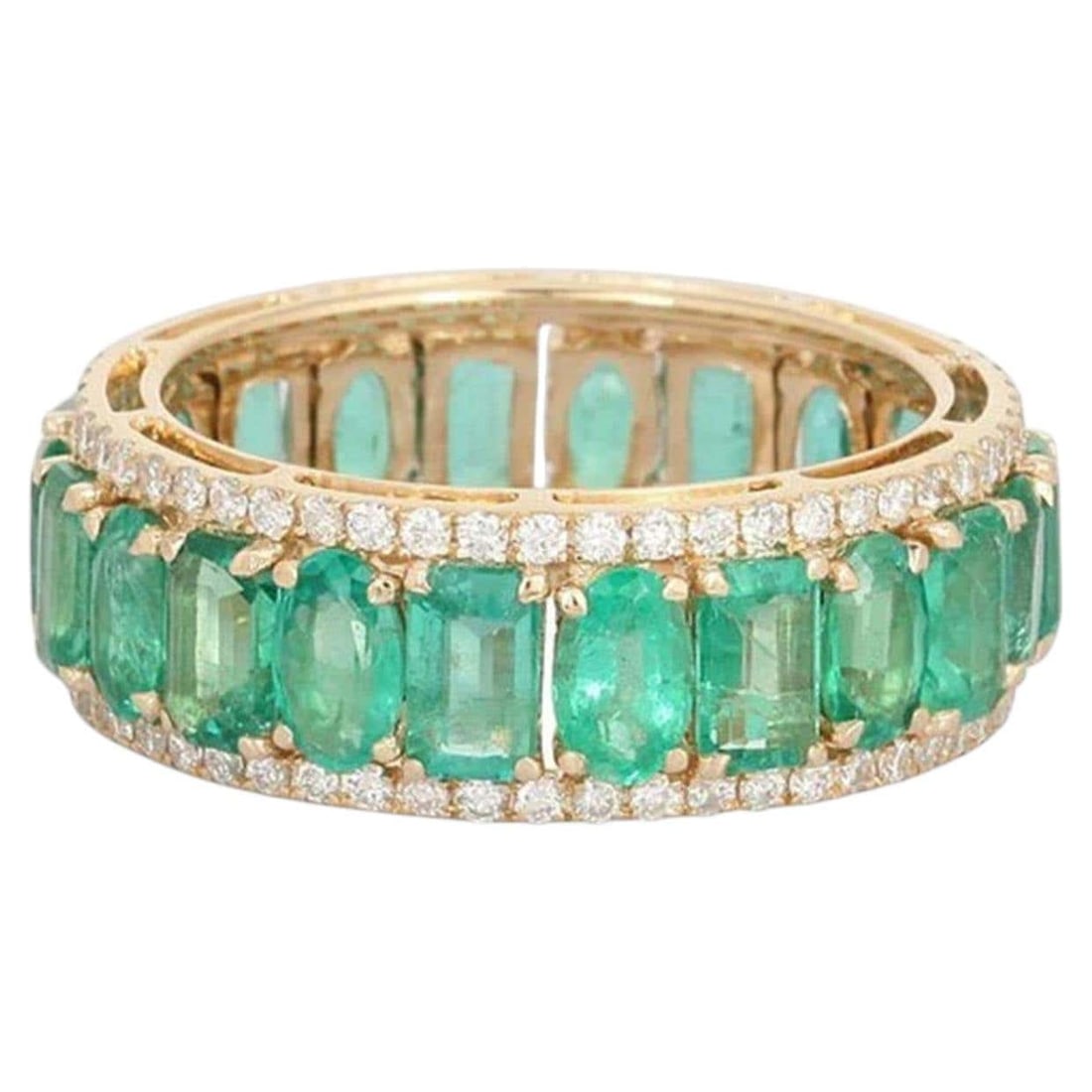 Emerald Round Baguette 14K (or 18k upon request) Yellow Gold Eternity Band Ring: The Emerald Round Baguette 14K Yellow Gold Eternity Band Ring blends the vibrant allure of emeralds with the sparkling brilliance of diamonds. Crafted in 14K yellow gold, this ring features 0.65 carat