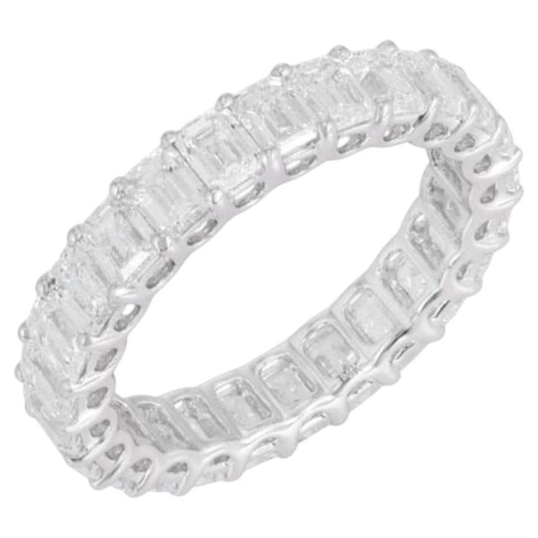 Eternity Band 18K White Gold Emerald Cut Diamond Ring: The Fancy Diamond Eternity Ring is a timeless masterpiece, crafted in luxurious 18K white gold. Featuring 25 fancy diamonds of exceptional clarity (FGVVS) and a total weight of 4.67 carats, each
