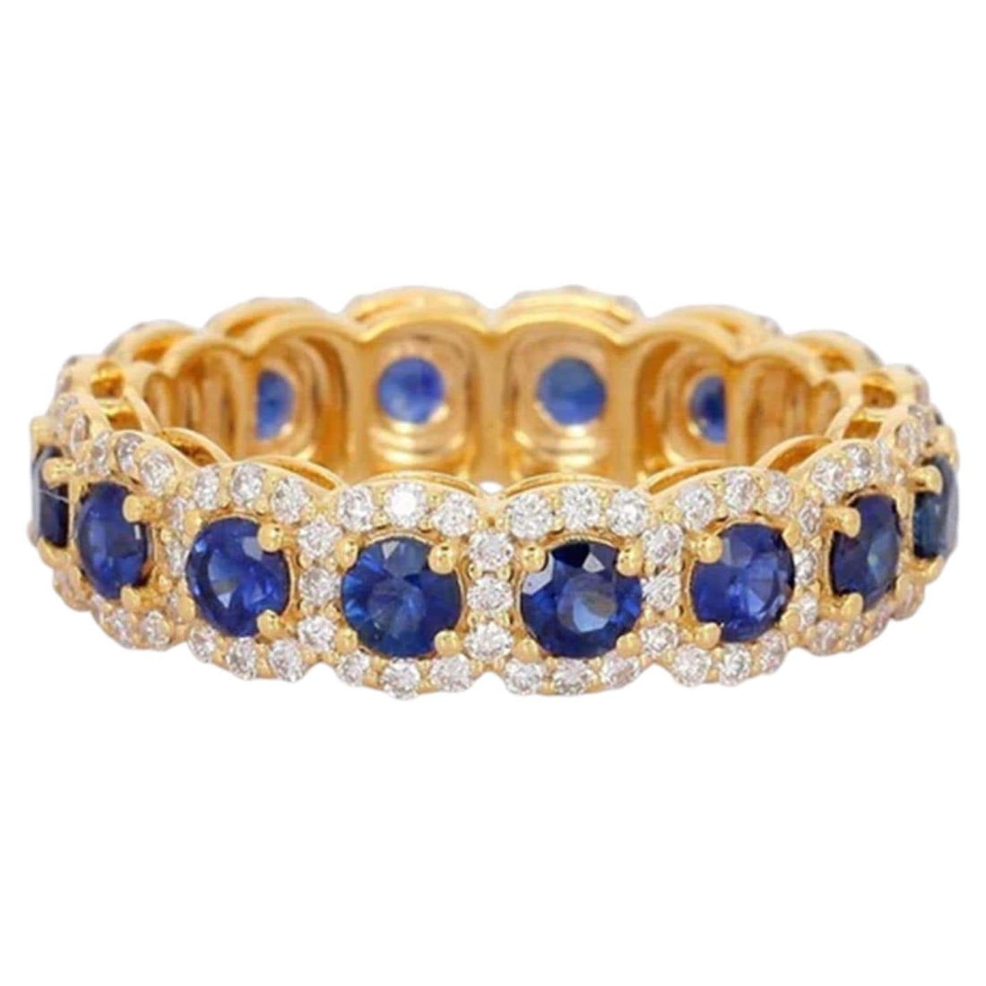 Eternity Band 14K (or 18k upon request) Yellow Gold Blue Sapphire Halo Ring: The Eternity Band 14K Yellow Gold Blue Sapphire Halo Ring is a graceful creation in 14K yellow gold, featuring a stunning combination of natural diamonds and vivid blue sapphires. This radiant design 