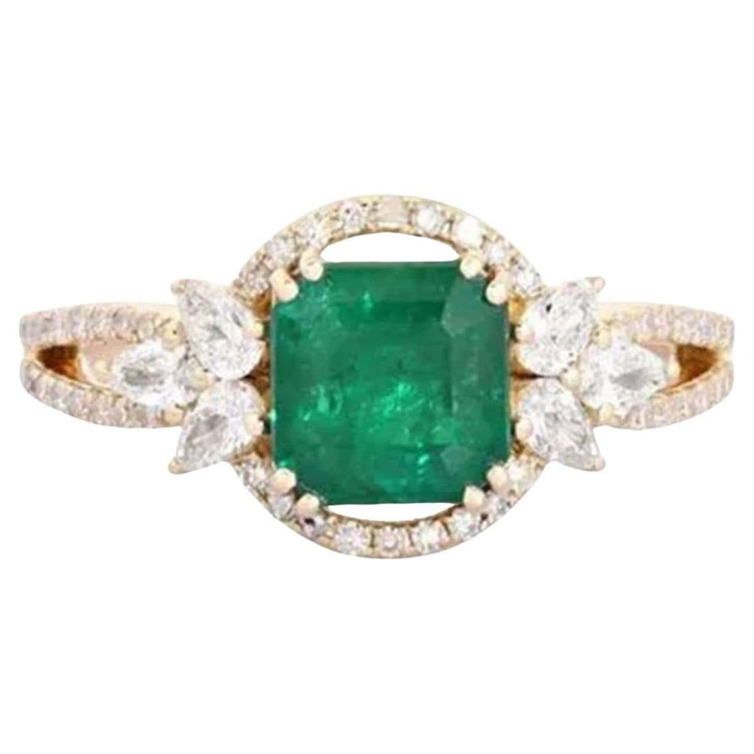 Emerald Halo Diamond 14K (or 18k upon request) Yellow Gold Statement Ring: The Emerald Halo Diamond 14K Yellow Gold Statement Ring showcases a breathtaking emerald center stone, crowned by fancy diamonds in a classic 14K yellow gold setting. The perfect blend of elegance and