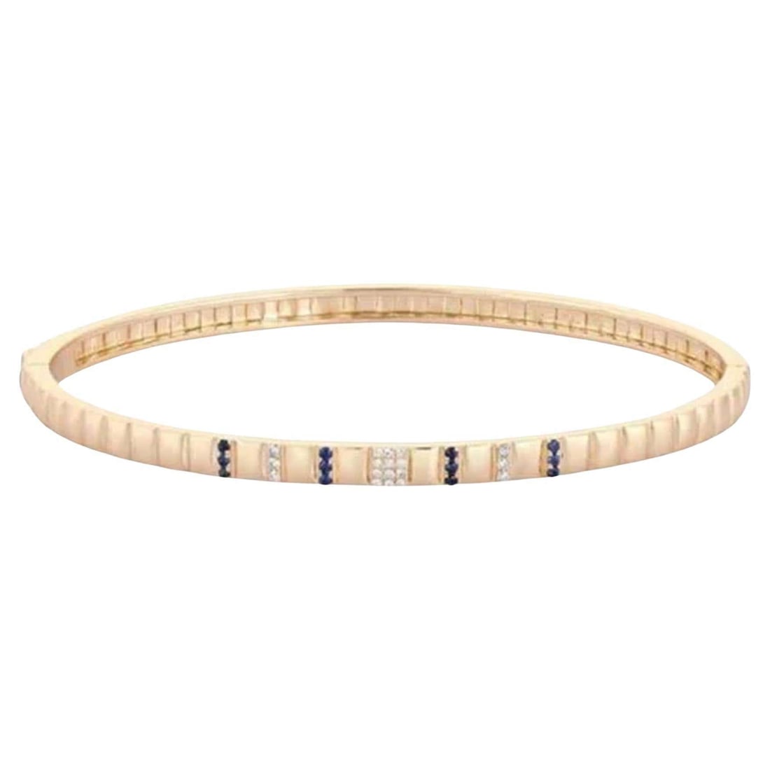 Blue Sapphire 14K (or 18k upon request) Gold Stackable Bangle Bracelet: The Blue Sapphire 14K Gold Stackable Bangle Bracelet features 0.06 carats of natural diamonds paired with 0.10 carats of vibrant blue sapphires, elegantly set in 14K yellow gold. Weighing 9.6 grams, t