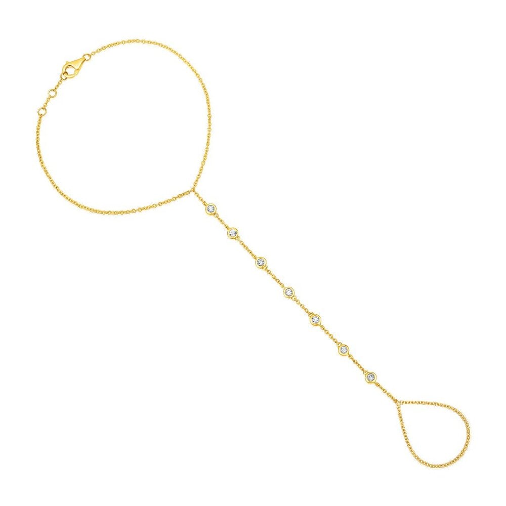7 Diamonds Droplet 14K (or 18k upon request) Yellow Gold Hand Chain: Featuring 7 shimmering natural diamonds. Perfect for those who appreciate understated luxury, this hand chain is crafted to perfection, offering both style and sophistication. Its timeless design make