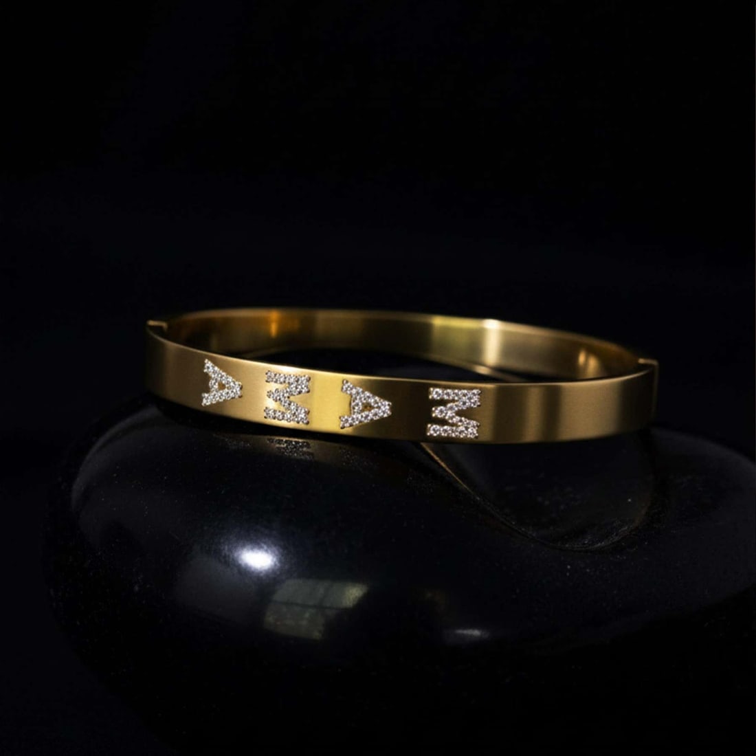 MAMA Bangle 14K (or 18k upon request) Yellow Gold Pave Letter Diamond Bracelet: Celebrate motherhood with timeless sparkle. This MAMA bangle bracelet is beautifully crafted in 14K yellow gold and features the word "MAMA" spelled out in shimmering pave set diamonds. The bold lette