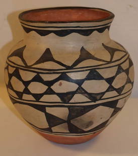 Indian Pottery: Possible Native American pottery. Measures 9" tall x 5.5" diameter of opening.