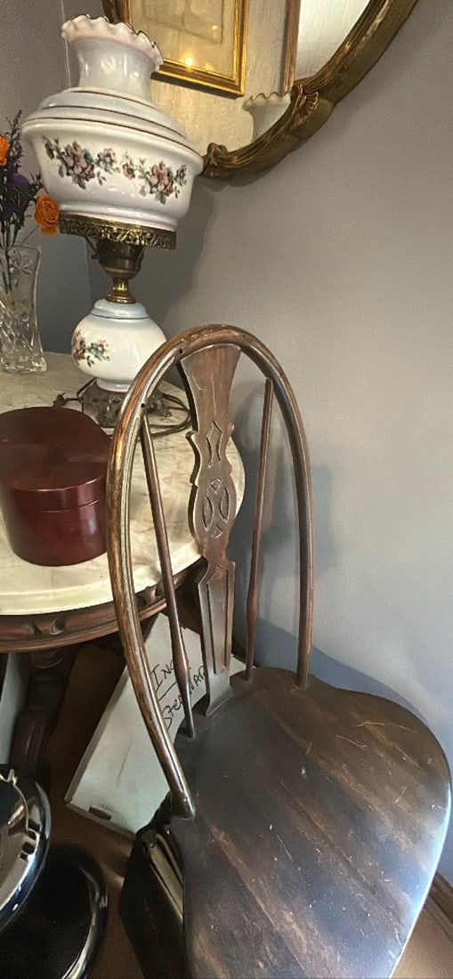 Antique Wooden Chair: This antique wooden chair features a classic design with a curved backrest and a sturdy seat. The wood shows some signs of wear, adding to its vintage charm. Ideal for adding character to any room or
