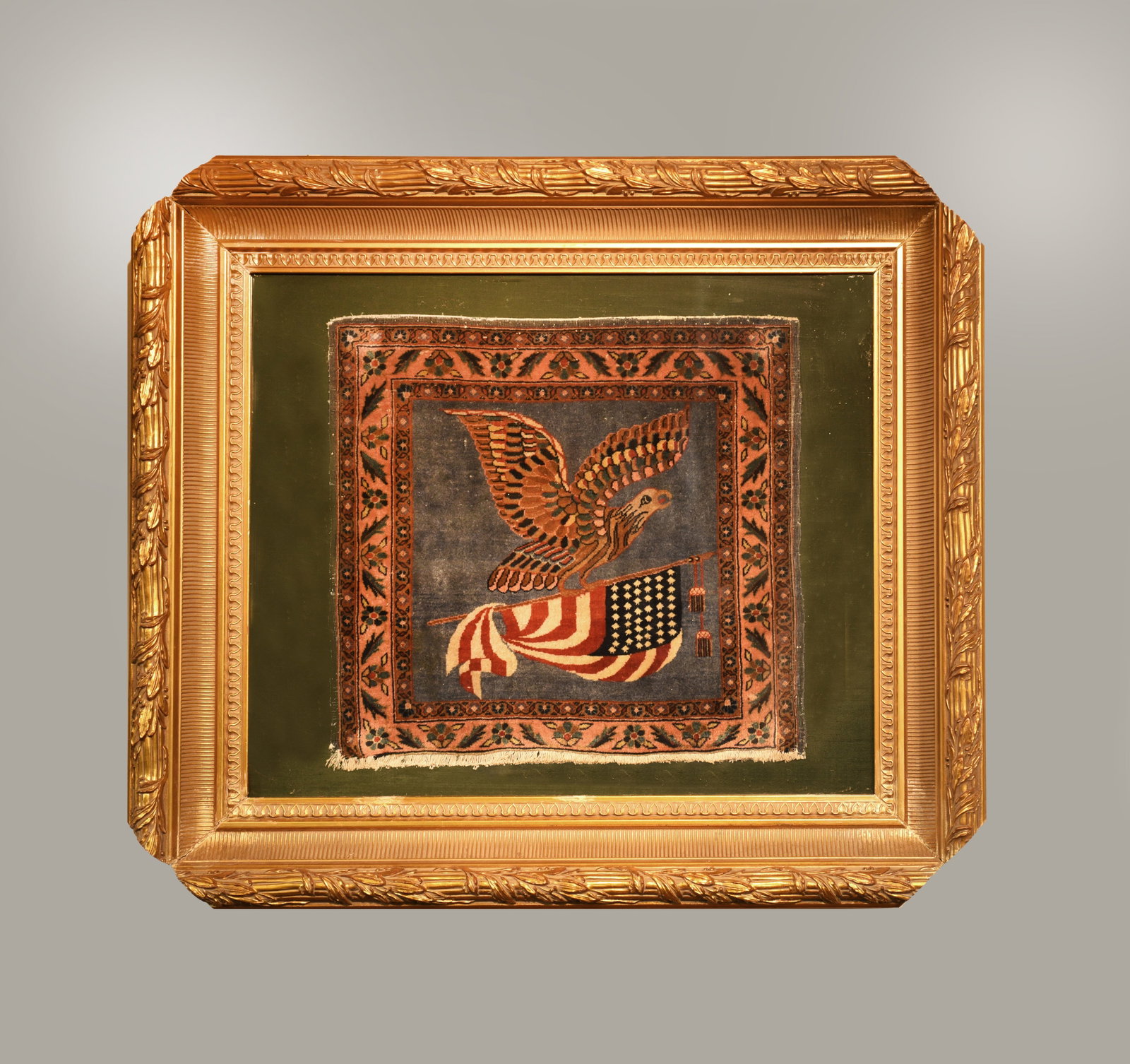 Antique American Eagle and Flag Persian Rug: This exquisite, hand-knotted Persian rug is a unique piece of art, showcasing a fusion of traditional Persian craftsmanship with American iconography. The central medallion features a powerful America