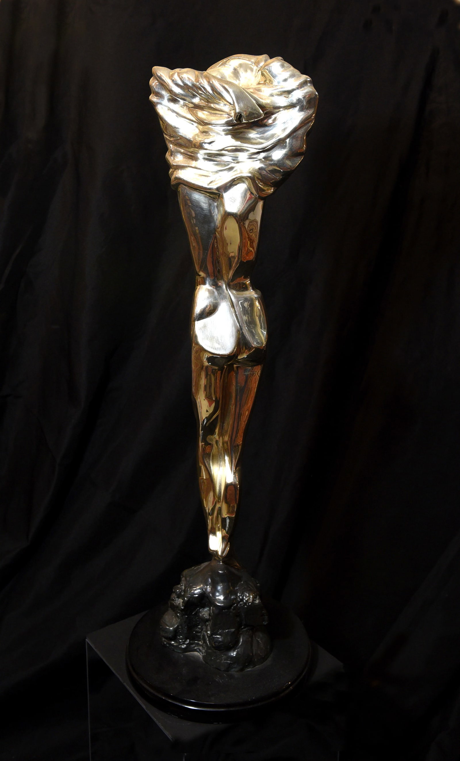 Glad" Silver Sculpture by Oshia, Limited Edition (45/500): A striking silver sculpture titled "Glad" by artist Oshia. This limited edition piece (number 45 of 500) features a stylized, elongated female figure with a gracefully draped head covering. The