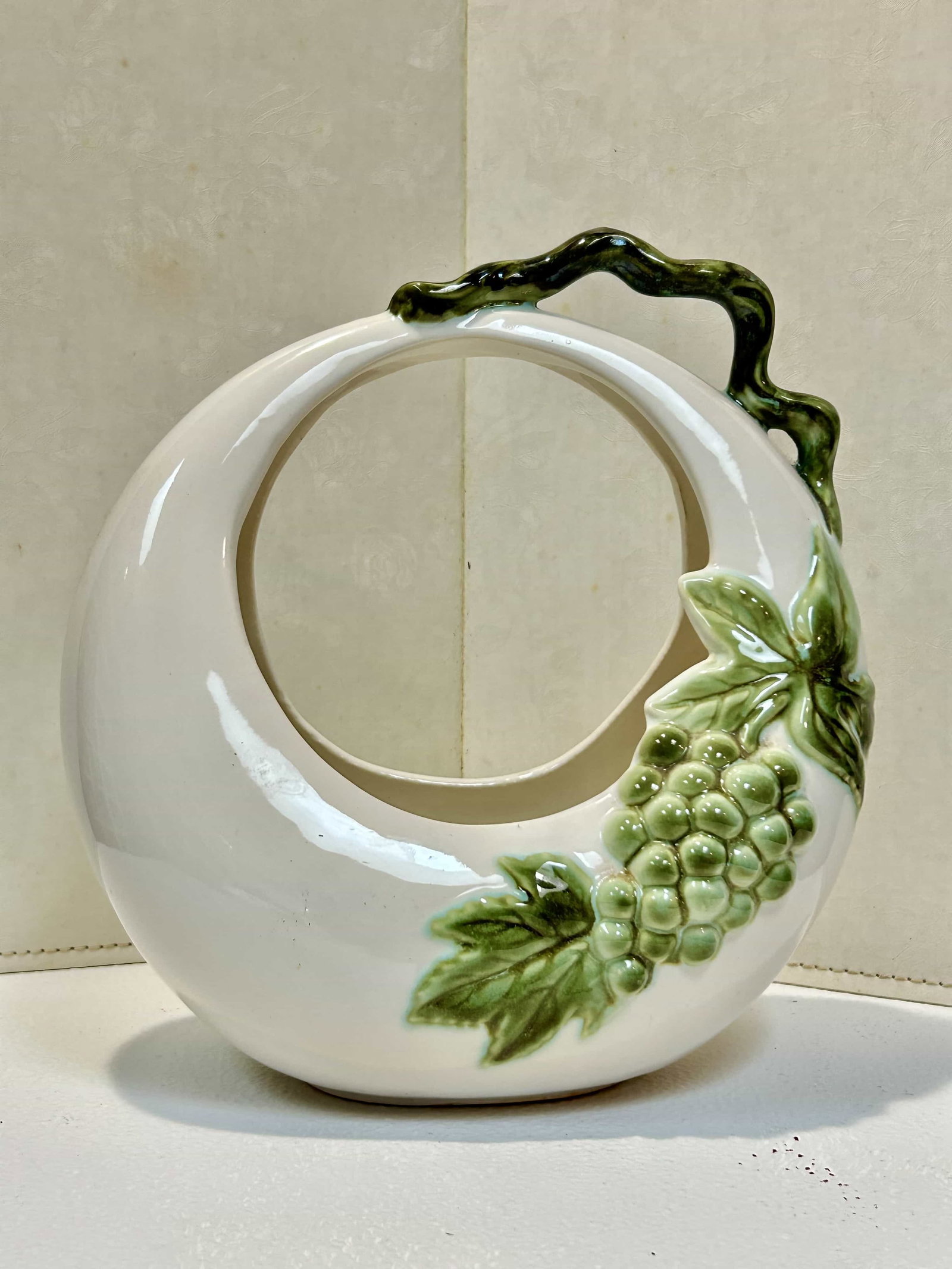 Vintage Hull Pottery Tokay Moon Basket Planter w/ Grape Motif: Vintage Hull Pottery Tokay Moon basket vase planter, in great condition (no cracks or chips). The vase measures 10.5" tall, and has "Tokay" on the bottom.