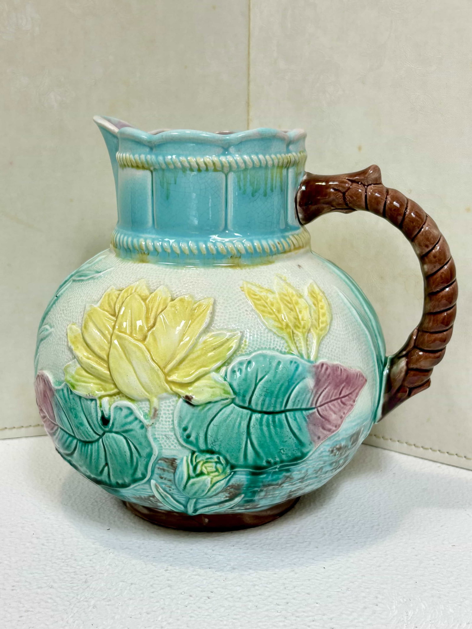 Majolica Pitcher, Samuel Lear "Pond Lily" Pattern: Victorian era Majolica pitcher by Samuel Lear "Pond Lily" pattern. This pitcher measures 9" tall and is in good condition with no visible chips or cracks.