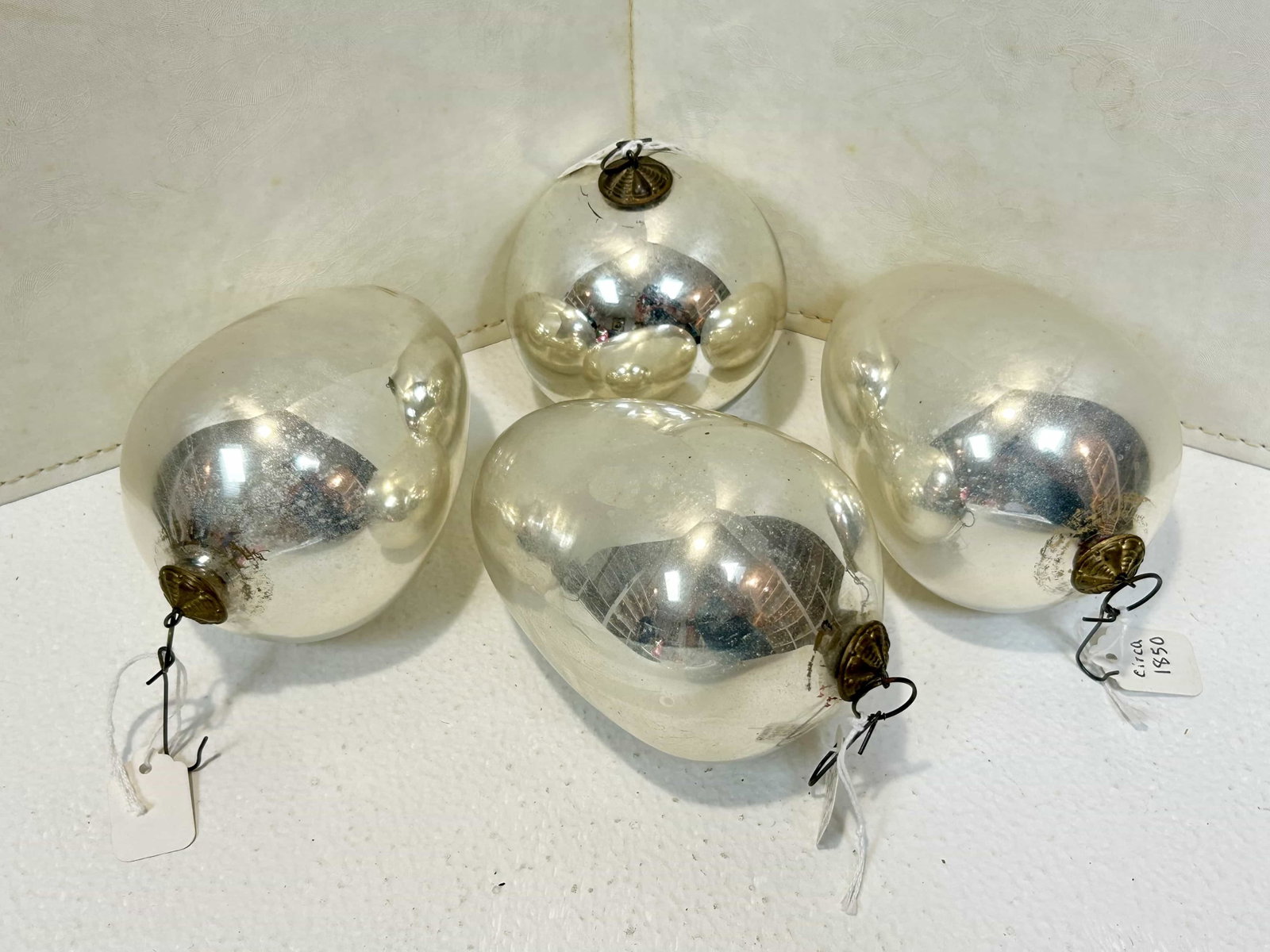 Antique Kugel German Mercury Glass Oraments, Lot of 4: Lot of 4 antique Kugel mercury glass ornaments. 1 round, measures 3.25" across, 3 egg shaped measuring 5" long x 3.5" wide. Original brass hook hangers. Appears to be in good vintage condition.
