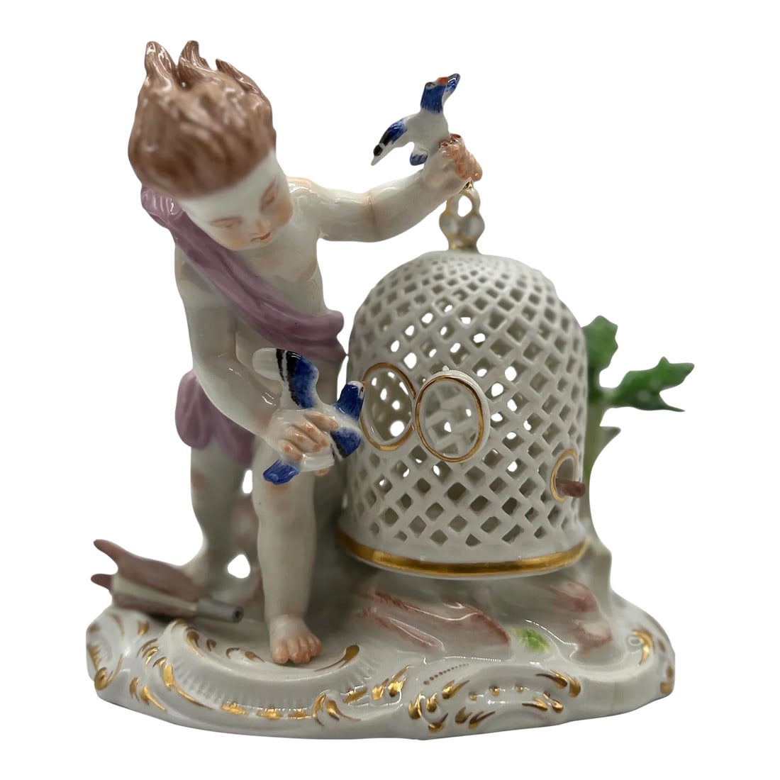 Antique Meissen Porcelain Boy & the Bird Cage Figure Model: Meissen, 19th century. A fine quality Meissen porcelain figurine depicting a young boy playing with his pet bird. The figure stands next to a pierced porcelain bird cage adorned with foliage. Marked t