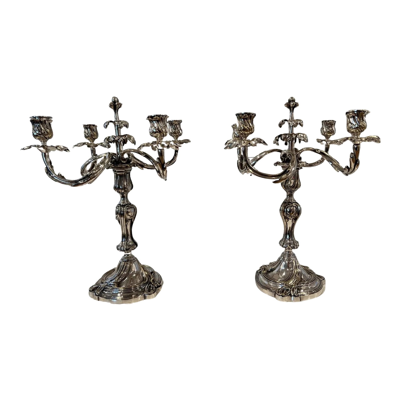 A Pair of French Christofle "Trianon" Silver Plate Candelabra: Christofle (French, founded 1830), L 20th century. Each silver plate candelabrum with a convertible candlestick column with knopped stem on a swirled rocaille base issuing five radial spiral arms,