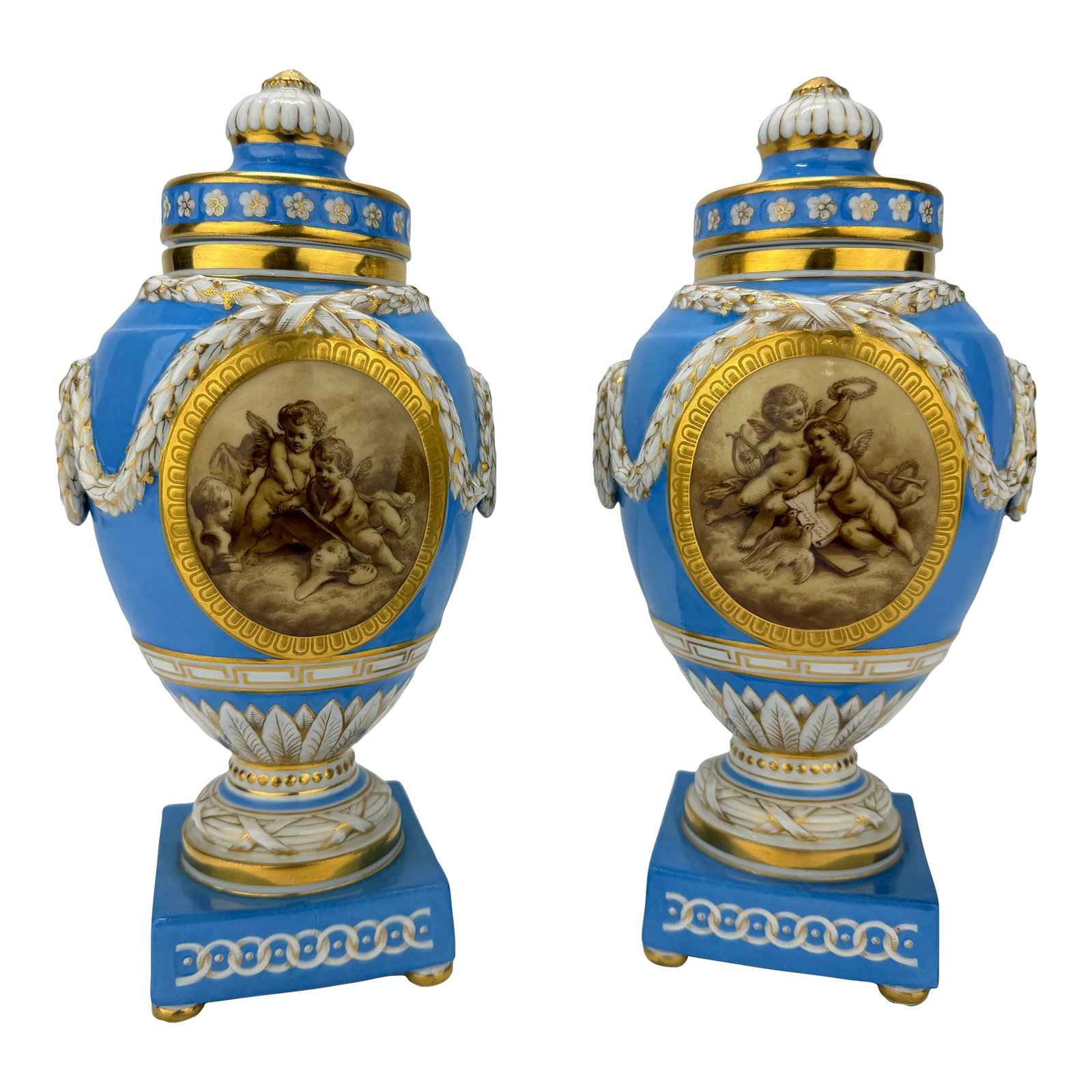 19th C. Kpm Porcelain Celestial Blue Ground & Grisaille Window Urns - Pair: This exquisite pair of 19th-century lidded urns, crafted by the esteemed Königliche Porzellan-Manufaktur (KPM) of Berlin, is a remarkable example of Neoclassical porcelain artistry. Each urn feat