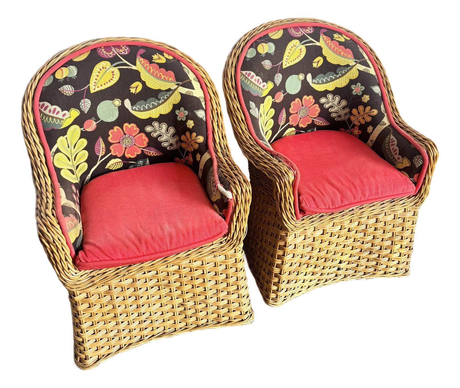 Vintage Boho Chic Wicker Lounge Chairs - A Pair: This inviting pair of vintage Boho Chic wicker lounge chairs captures the relaxed elegance of classic Florida interiors. Handwoven wicker frames feature a warm honey tone with beautifully rounded back