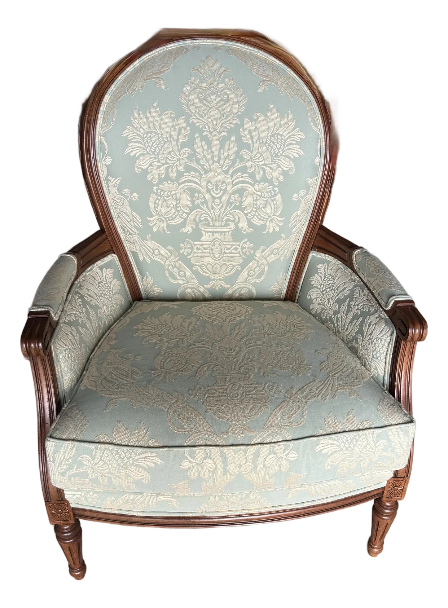Louis XVI Style Berger'e Armchair: This chair displays a classic Louis XVI style, as evident in its elegant lines, oval backrest, and carved details on the frame, which likely dates to the late 19th century as a revival piece. This is 
