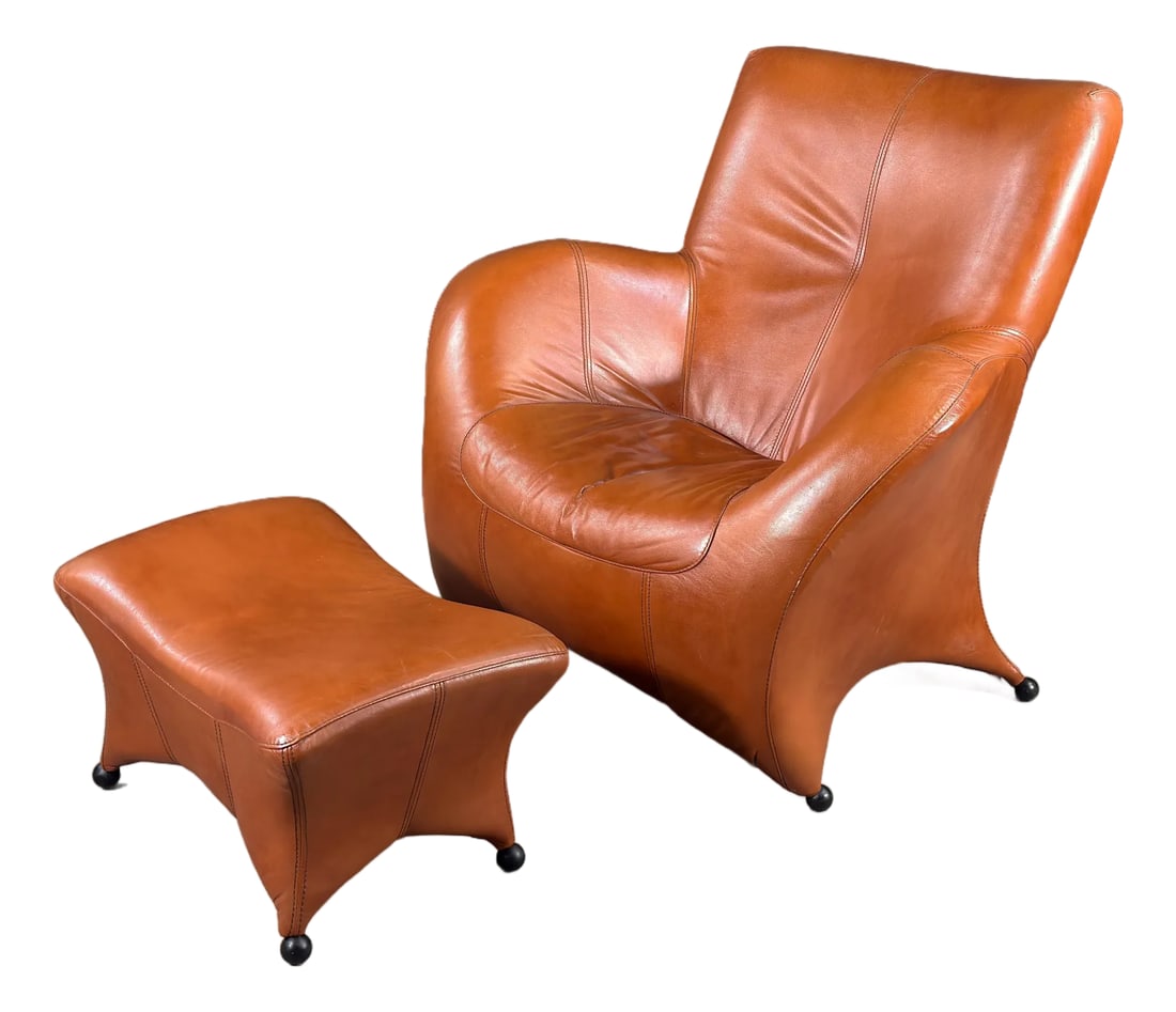 Gerard Van Den Berg Style Leolux Cognac Leather Lounge Chair and Ottoman, Netherlands, 1990s: This lounge chair and ottoman is either by or inspired by Gerard van den Berg, and produced by Leolux of the Netherlands. It is a well-executed example of the organic, body-hugging leather furniture