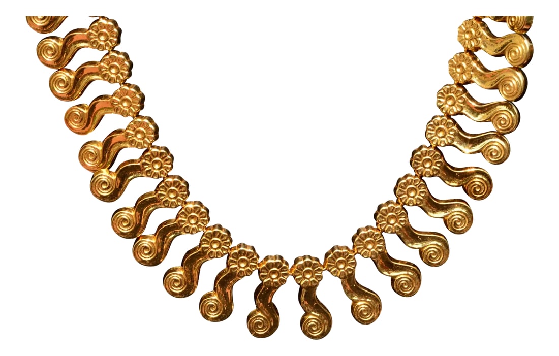 The Andros: Yellow Gold Zolotas Signed Necklace: The Andros:Â Yellow Gold Zolotas Signed Necklace. The necklace features an elongated J swirl or Fibonacci end extended and topped with a floral design. This pattern continues around the