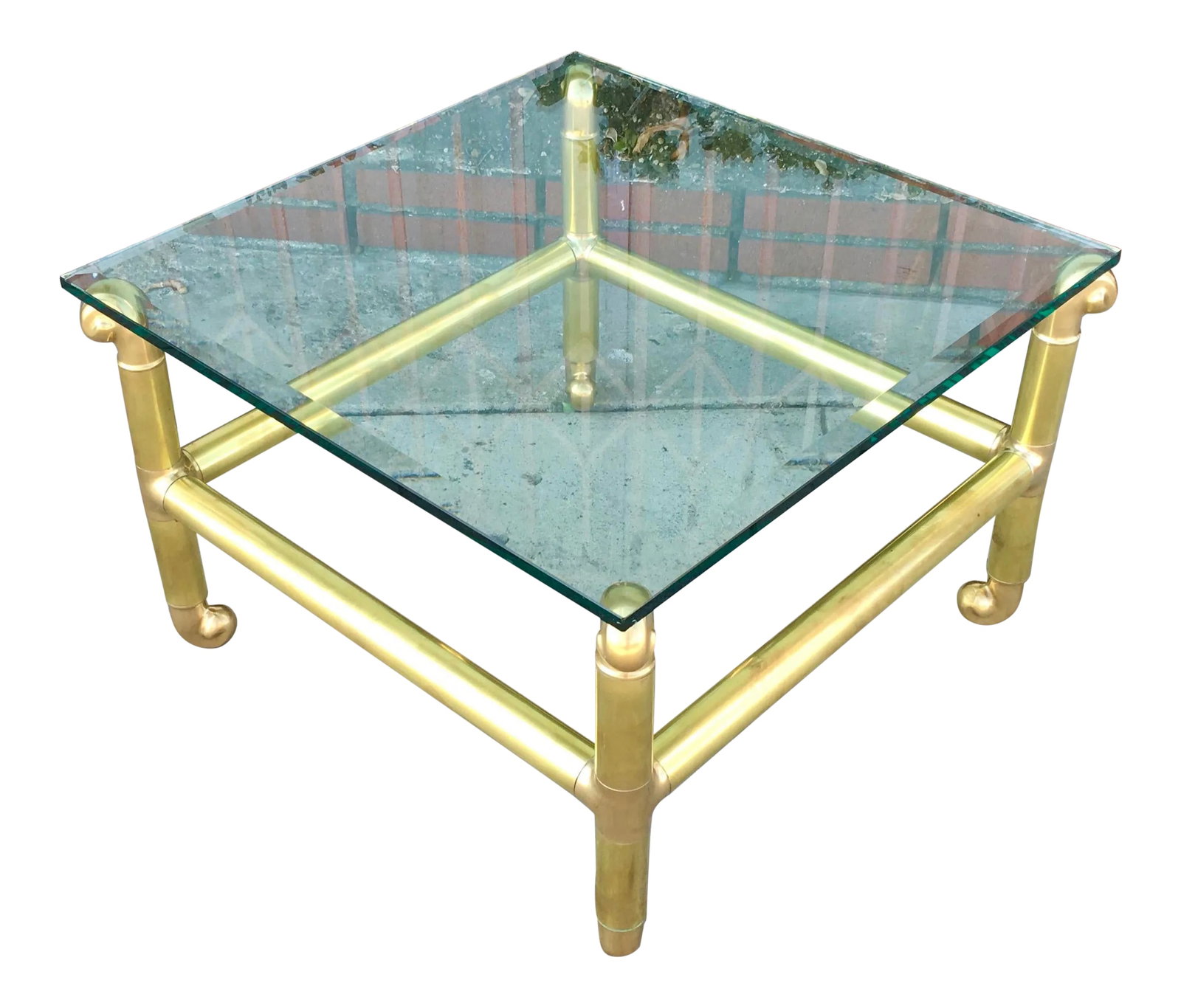 1970s Mid-Century Brass Coffee Table: This vintage brass coffee table is in great condition with no chips or cracks on the glass, theres no dents on the brass base. Condition: Alterations: Restored Imperfections: Some Imperfections