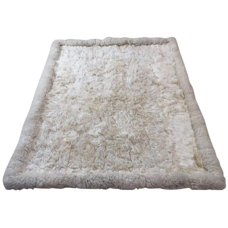 Vintage Shaggy Sheepskin Bed Throw or Rug | New Zealand Natural Ivory White 1970: Vintage 1970s Shaggy Sheepskin Bed Throw or Rug | New Zealand Natural Ivory White A luxurious 1970s-style shaggy sheepskin bed throw or rug, hand-quilted from pieces of fluffy wild sheepskin and sewn