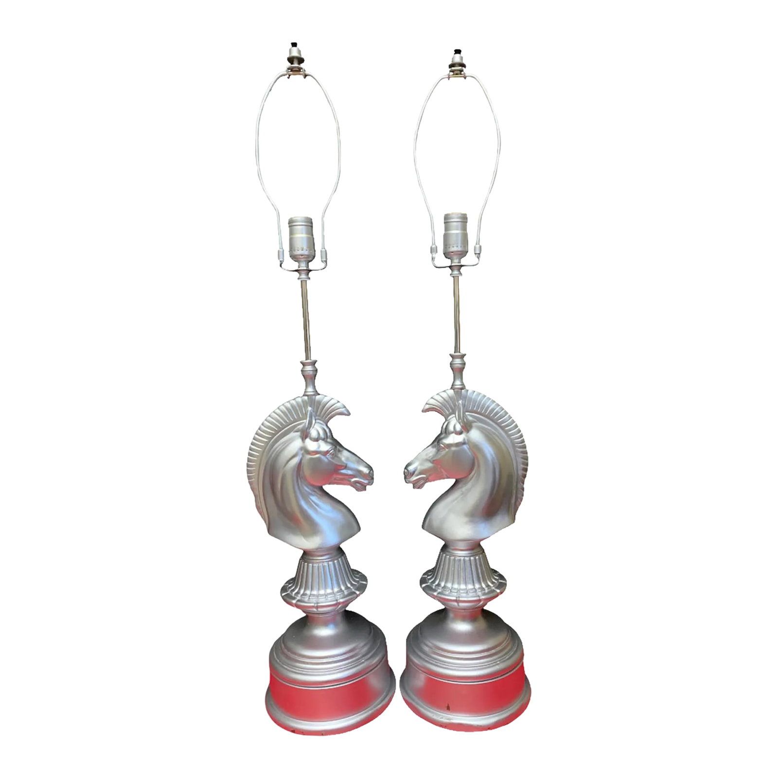 Mid-Century Silver-Toned Brass Lamps Chess Knight Design- Pair: This mid-century pair of silver-toned brass lamps features a striking chess knight design. Each lamp showcases an exquisitely detailed horse head, with a mane reminiscent of the horsehair plume found