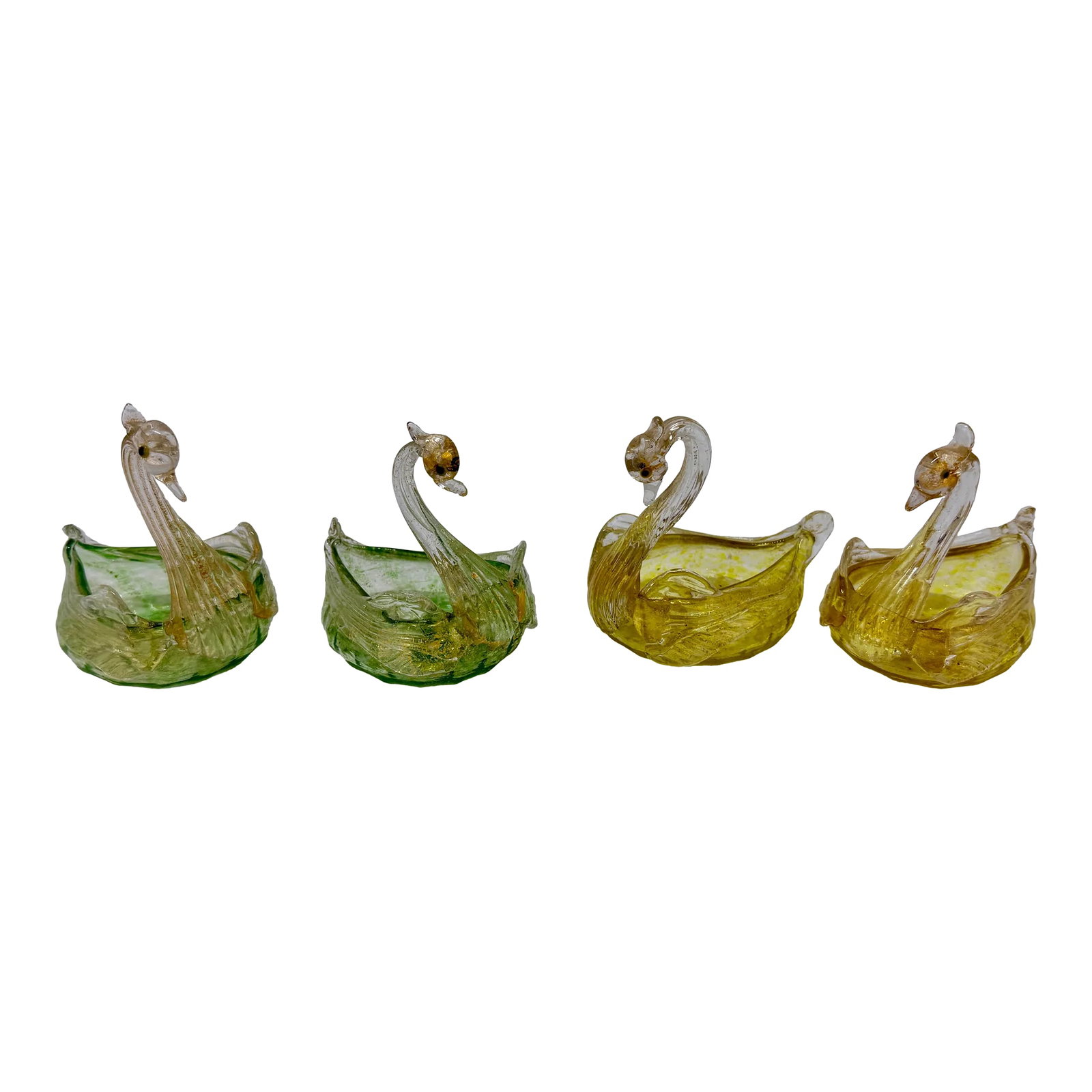 Set of 4, Mid Century Italian Murano Glass Swan Form Salt Cellars C. 1960: This set of four exquisite Murano glass salt cellars captures the timeless elegance and craftsmanship of mid-century Italian glassmaking. Each cellar is delicately shaped in the form of a swan, with