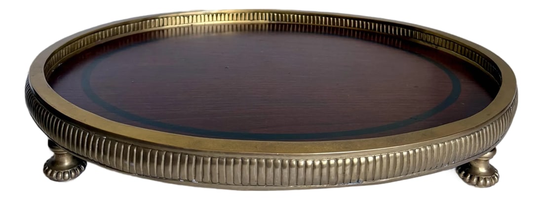 Traditional Neoclassical Oval Wood and Brass Footed Tray: Here is a stunning tray featuring a brass base with rich, brown wood surface. The tray is in a Traditional/Neoclassical/Revival style - but really she works so well in so many interiors! The brass