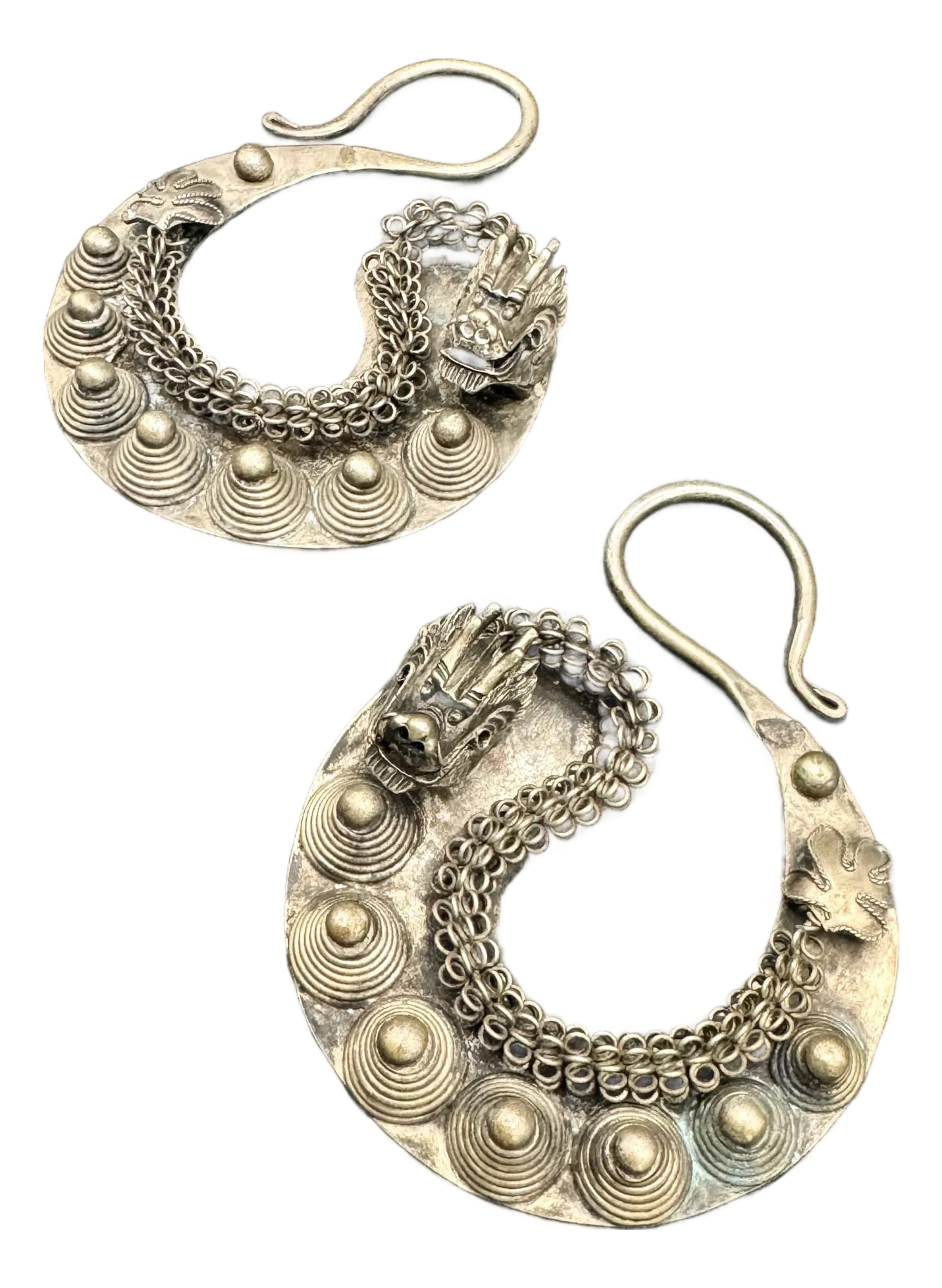 Vintage Miao Tribal Silver Dragon Earrings. Asian Tribal Jewelry, A Pair: These vintage Asian Miao people tribal silver earrings are a unique find. Handcrafted silver earrings with circular designs, Asian characteristic, and Dragons are in a three dimensional effect. The