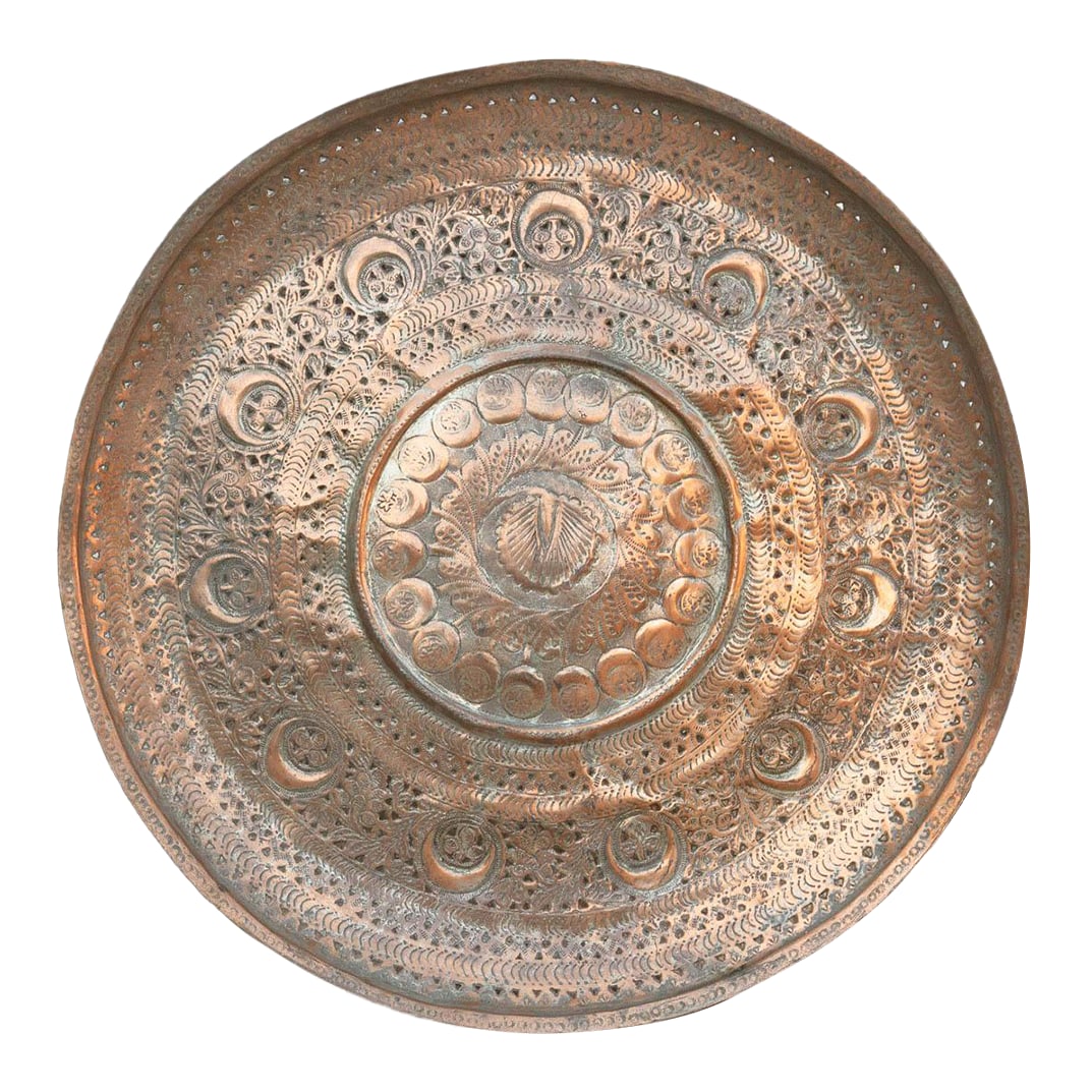 Mughal Crescent, Moon Serving Tray Platter: This piece is mesmerizing because of its precision. The surface is covered in tight, concentric bands of hand-engraved floral and geometric motifs that radiate from the center like a mandala. It