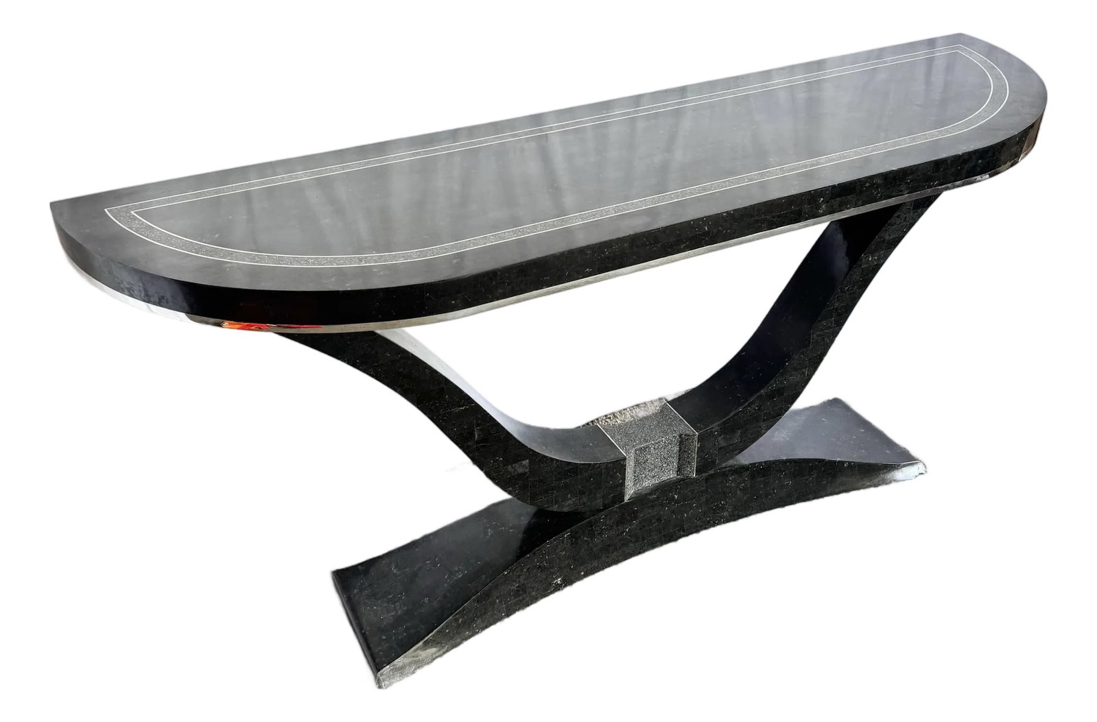Art Deco Sculptural Black Tessellated Stone a Console Table With Chrome Inlay: A striking example of late Art Deco–inspired craftsmanship, this sculptural console table features a dramatic curved pedestal base clad in black tessellated stone. The elongated top showcases a