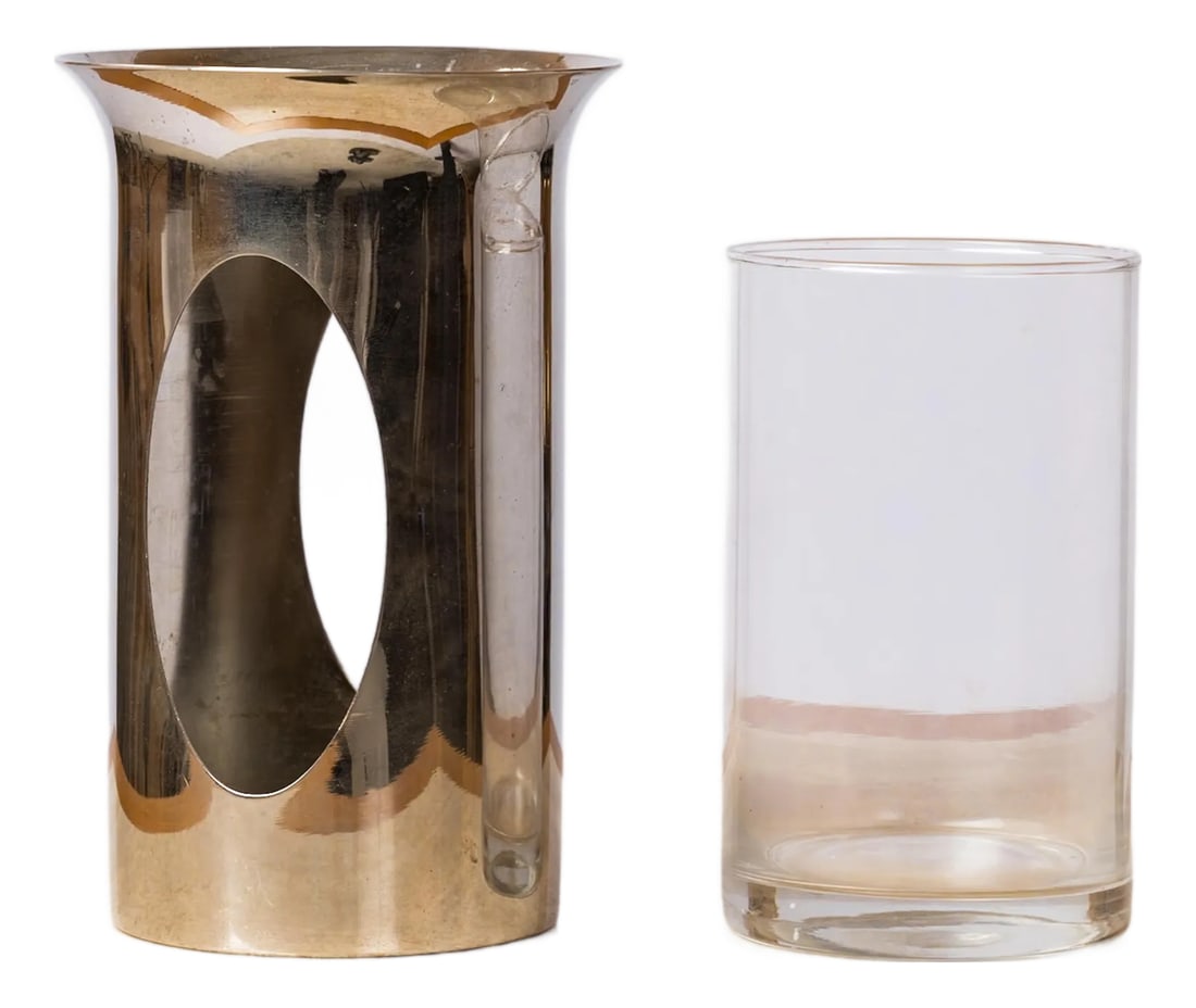 Philippe Barbier Chrome-Plated Brass & Glass Photophore Candleholder or Vase: Philippe Barbier chrome-plated brass photophore candleholder or petite vase, with clear glass insert. Two oval openings allow light to shine through. Stamped on underside. Barbier worked in Paris