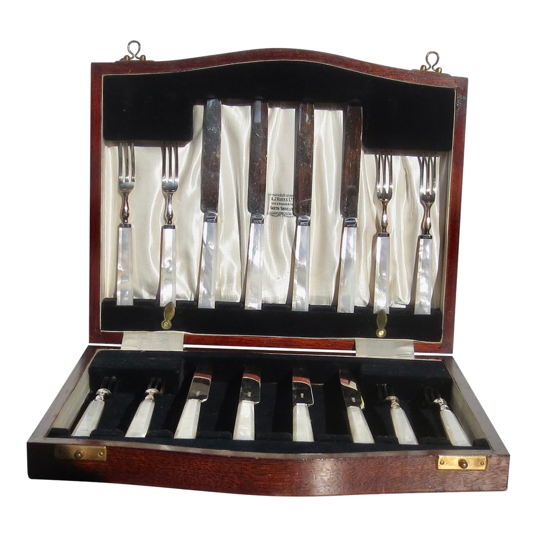 Vintage Mother of Pearl Boxed Serving Set: The set is 16 pieces in a wooden case. The box measures 11.25" by 9". The knife is 7.25" long, and the fork is 5.75" long. Handles are mother-of-pearl with beveled angles. Very clean silver plated.