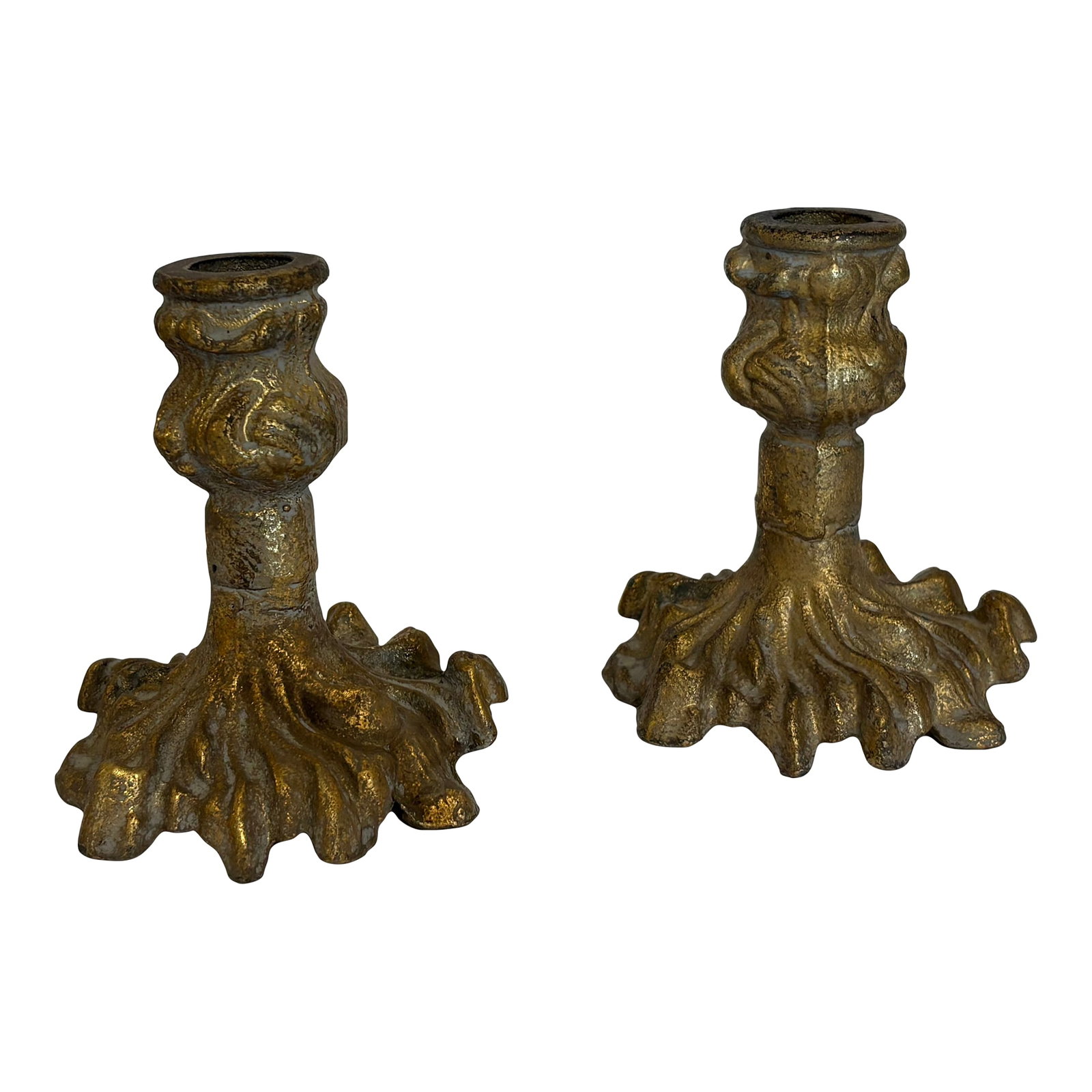Heavy Brass French Rococo Candle Holders, Circa 1910-1915: Ornate, rustic brass candle stick holders created to hold standard tapered candles. They feature inticate stylized floral and leaf shaped bases. The stand at 5" tall and are 4" wide and deep. They hav
