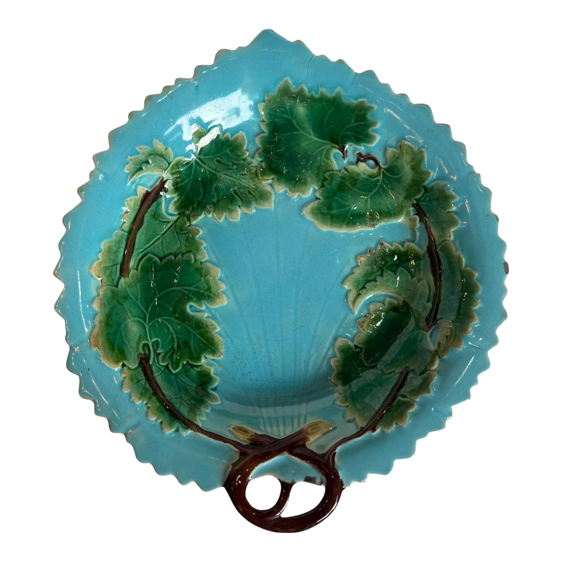 Majolica Tray: A richly glazed majolica tray featuring vibrant color and sculptural detail, characteristic of traditional European ceramic artistry. The surface displays a lively interplay of tones, with a glossy